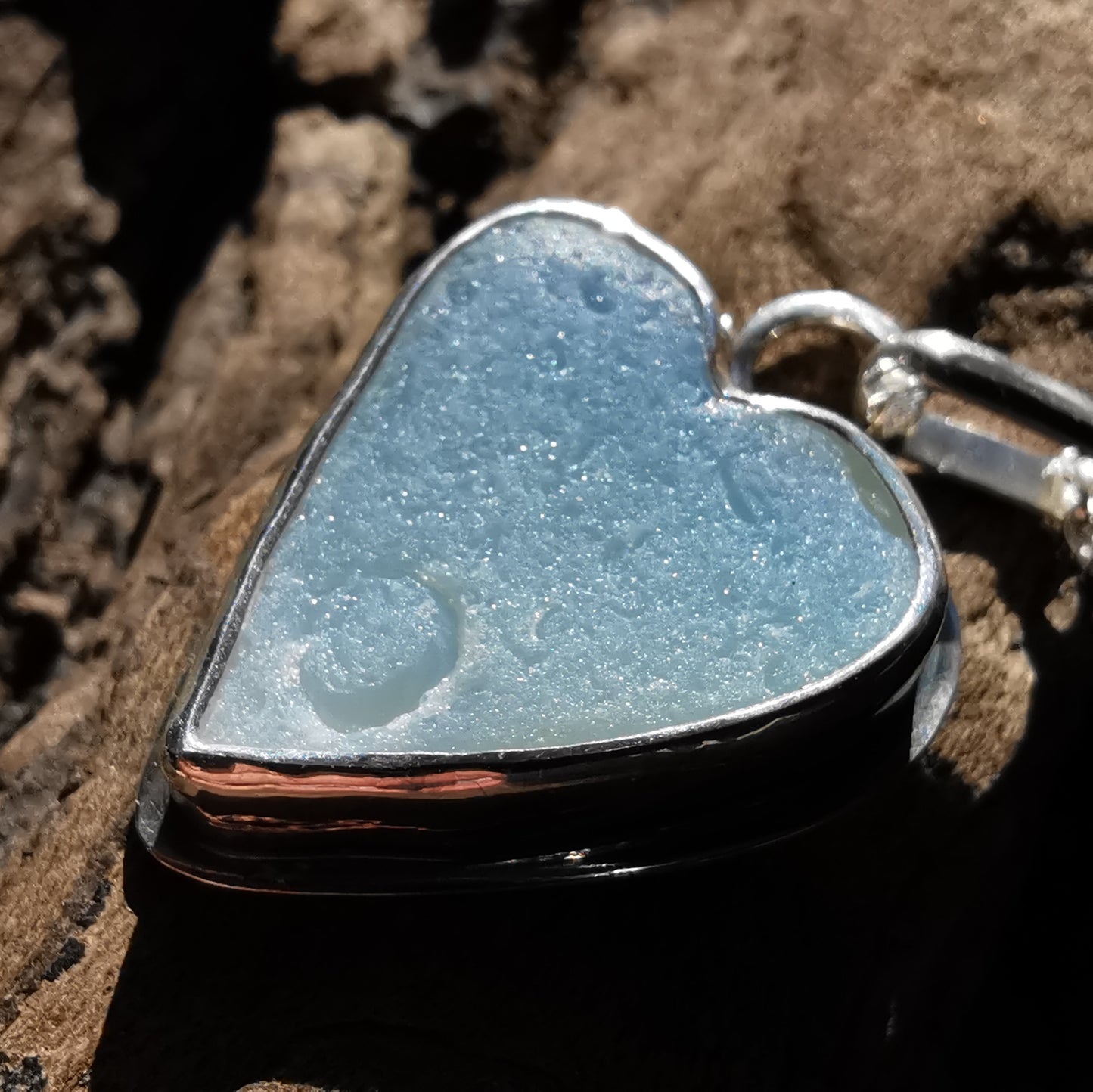 Reserved. Opalescent sea glass heart & sterling silver pendant.