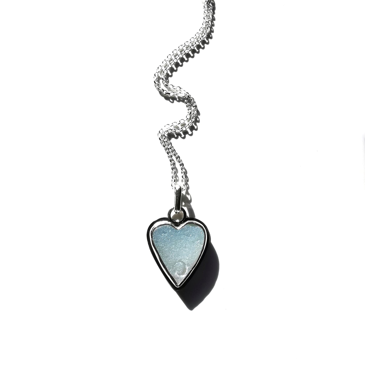 Reserved. Opalescent sea glass heart & sterling silver pendant.