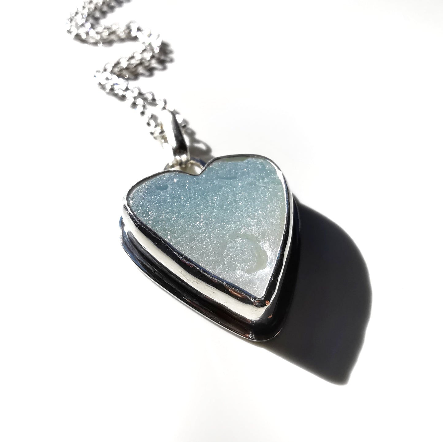 Reserved. Opalescent sea glass heart & sterling silver pendant.