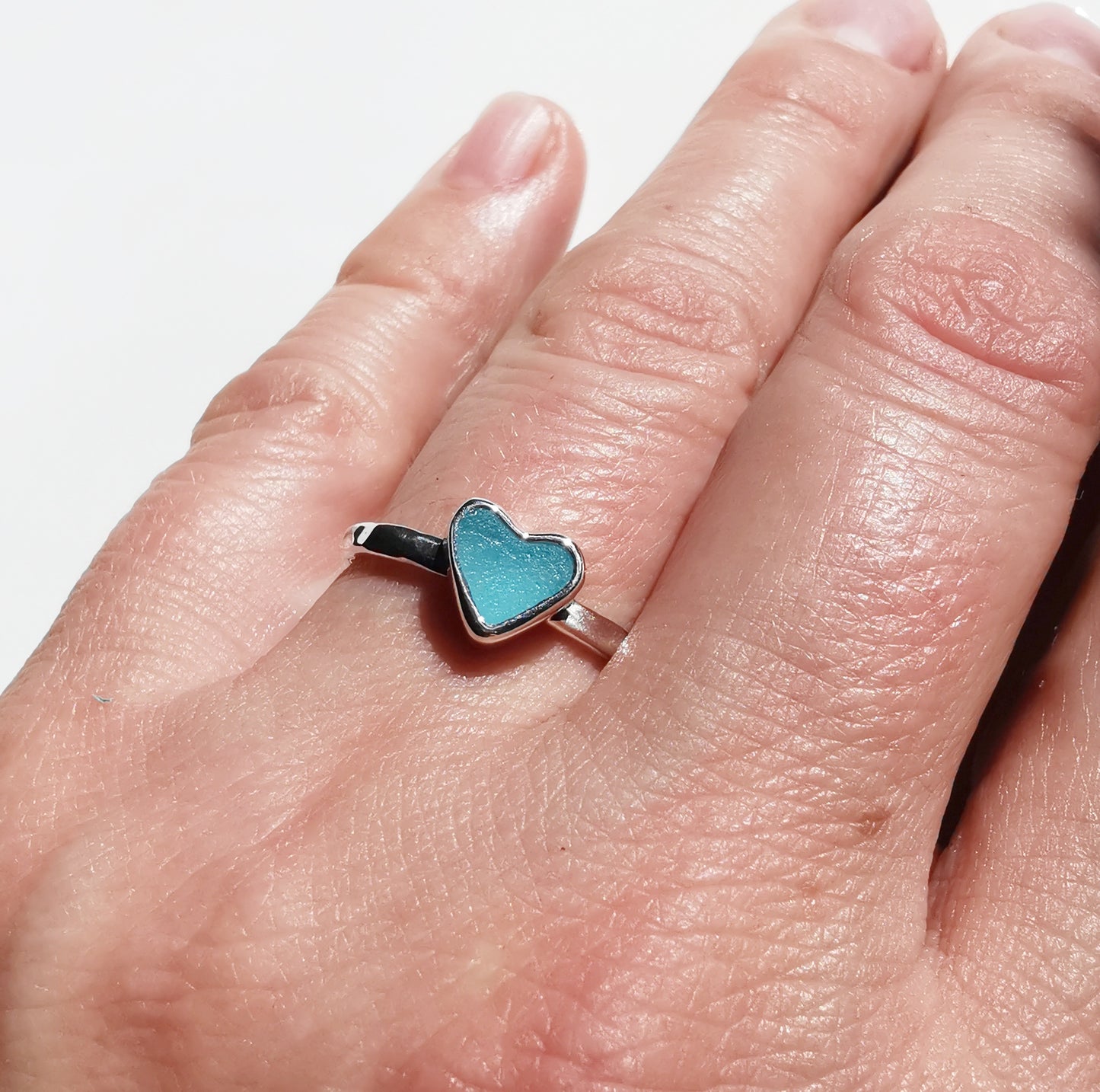Tiny Scottish aquamarine blue glass heart & sterling silver ring.
