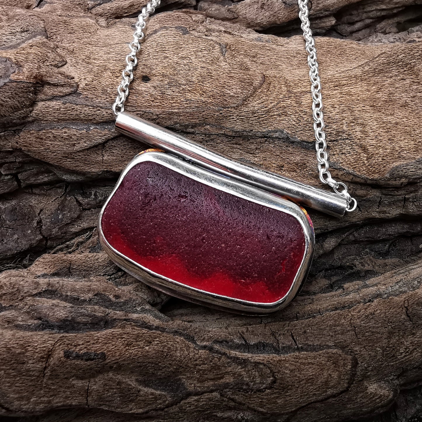 Scottish red sea glass & sterling silver pendant.