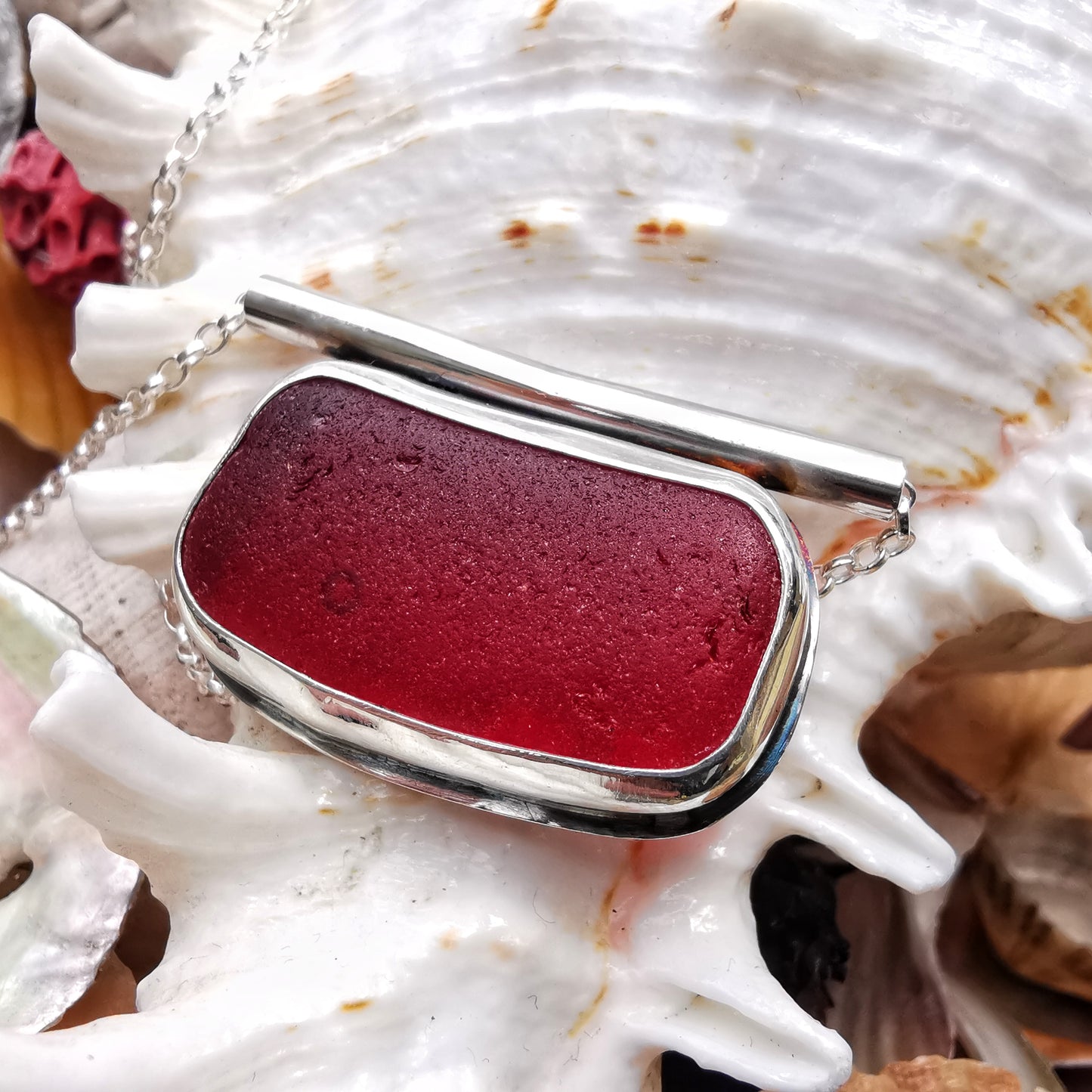 Scottish red sea glass & sterling silver pendant.