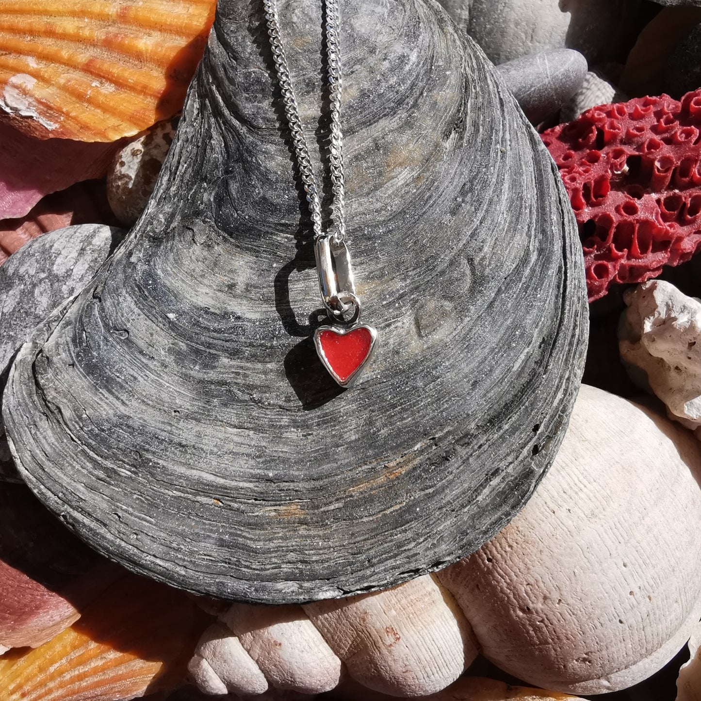 Tiny Scottish red sea glass heart & sterling silver pendant.