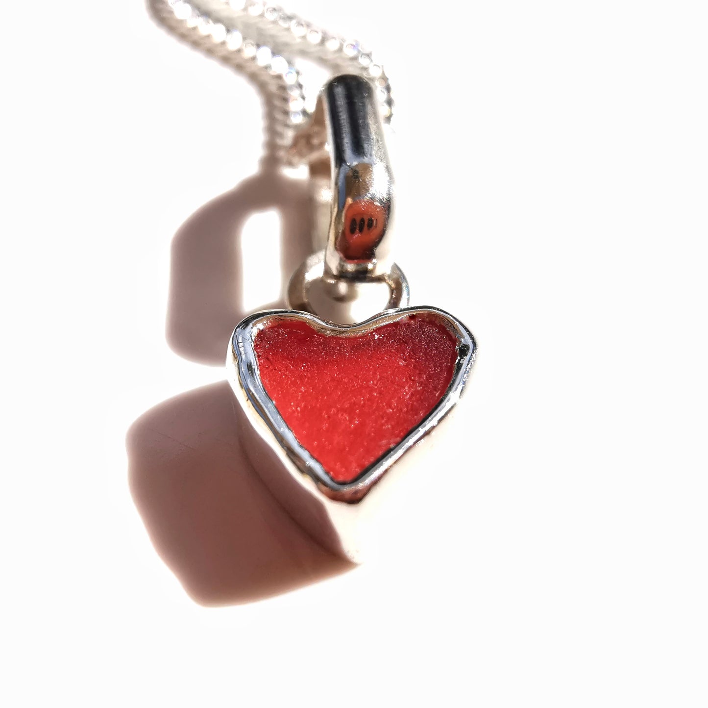 Tiny Scottish red sea glass heart & sterling silver pendant.