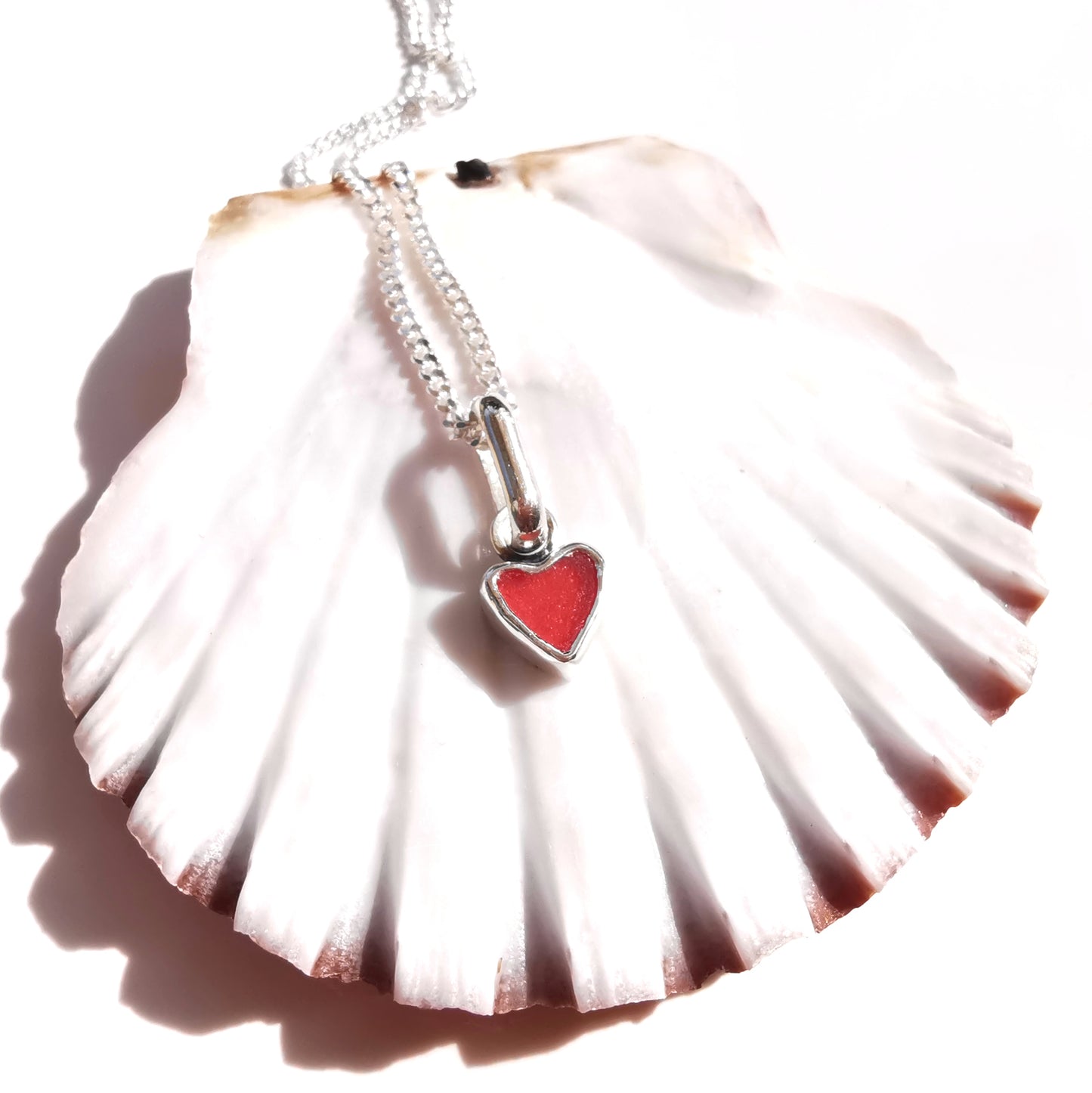 Tiny Scottish red sea glass heart & sterling silver pendant.