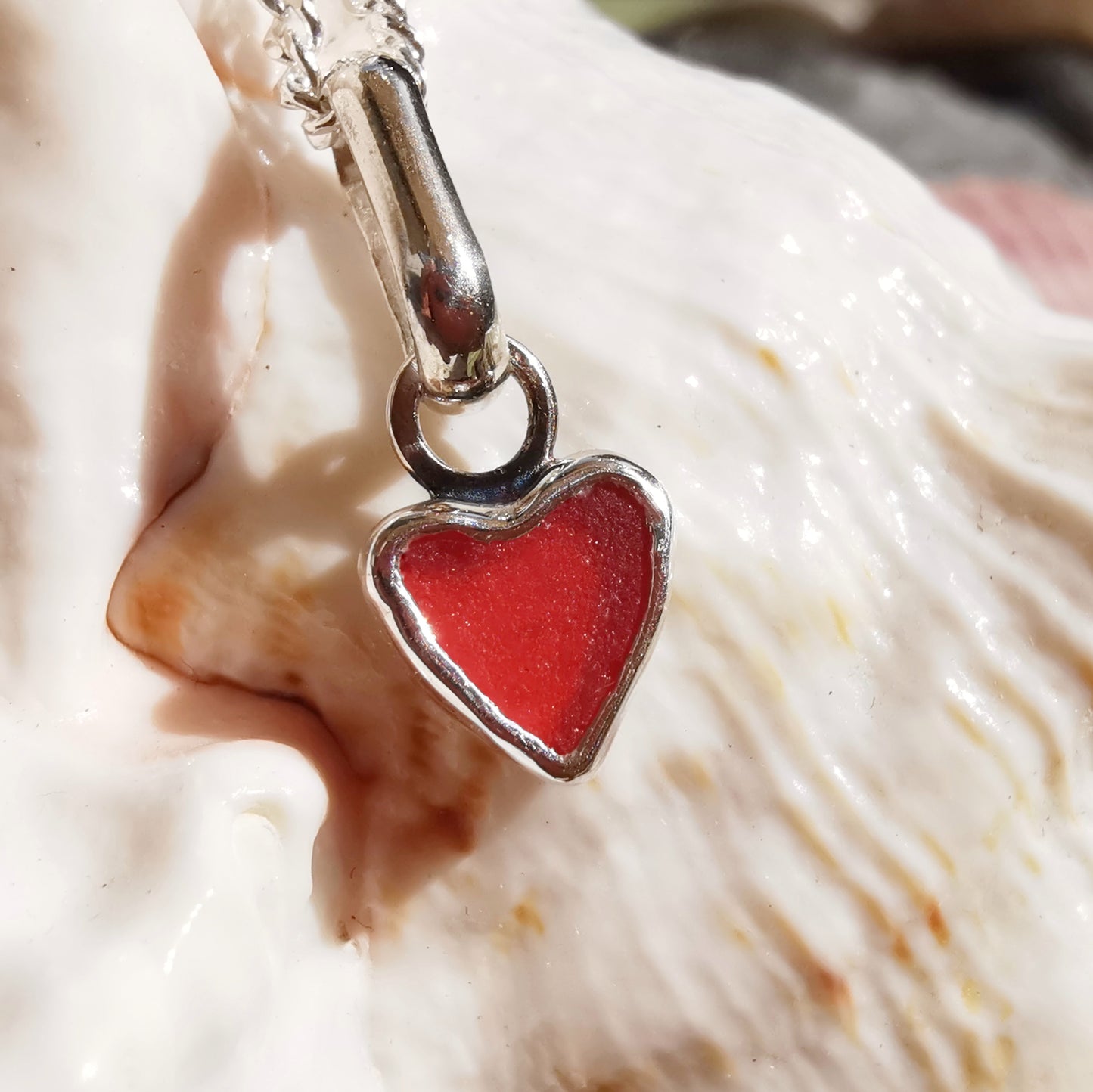 Tiny Scottish red sea glass heart & sterling silver pendant.