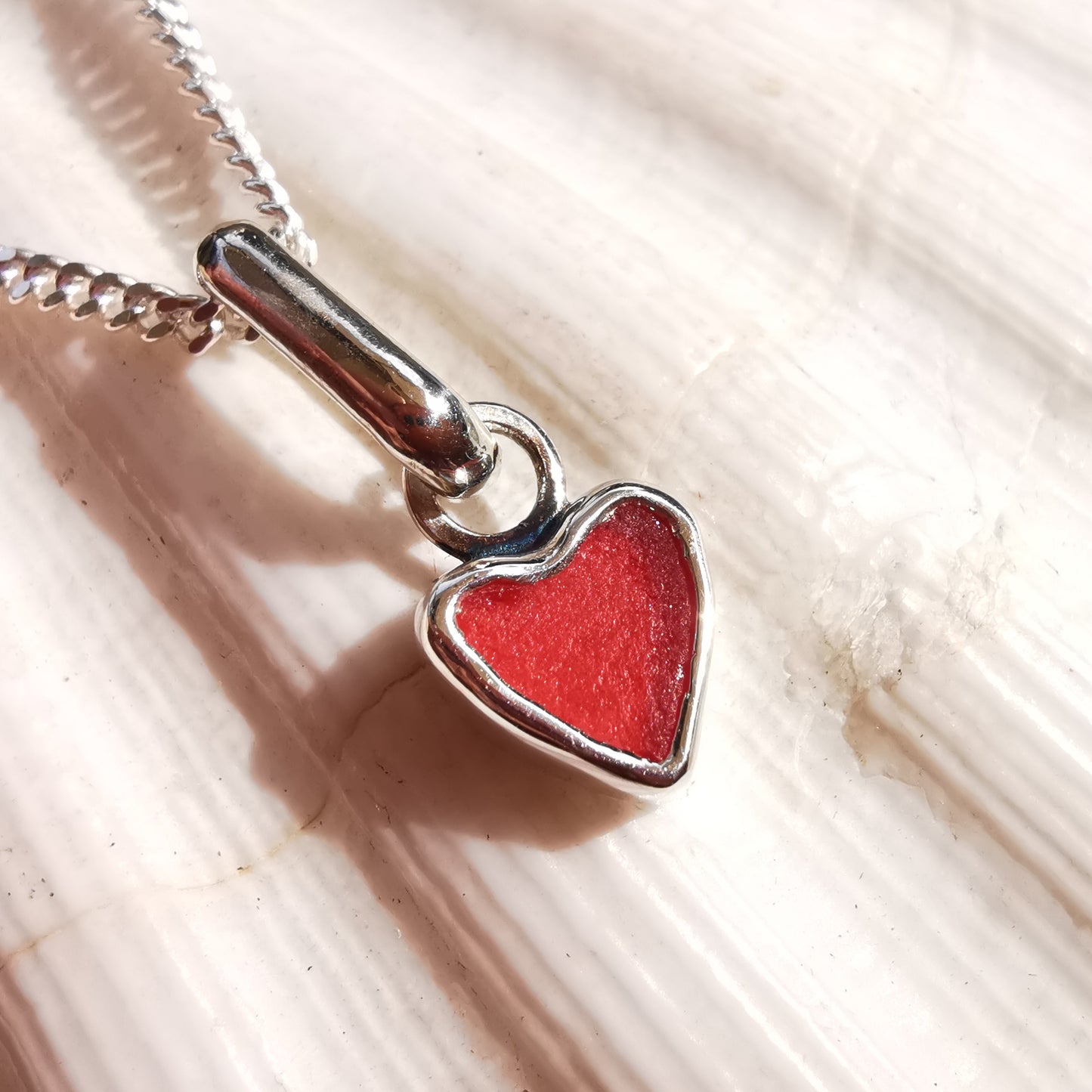 Tiny Scottish red sea glass heart & sterling silver pendant.