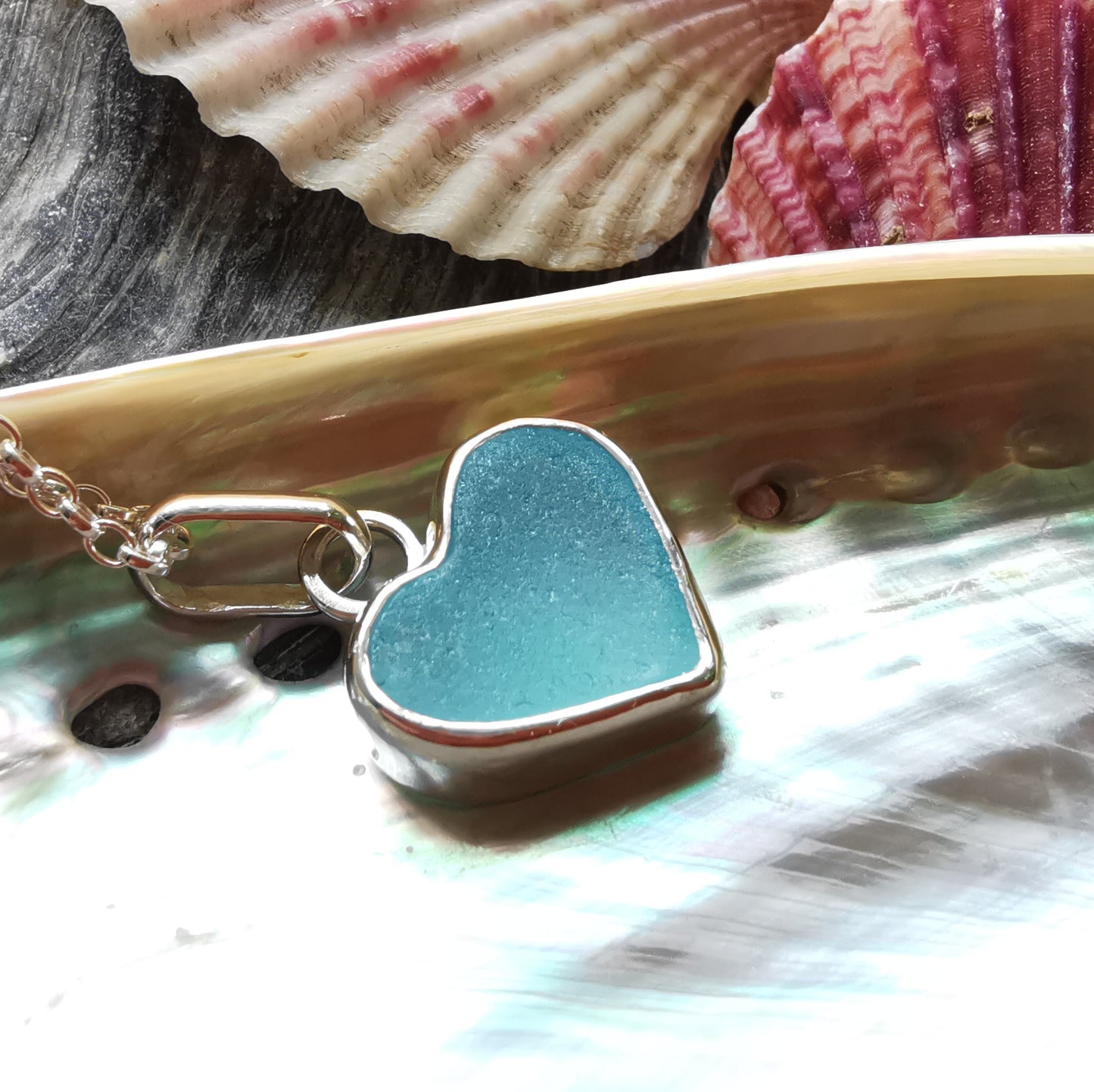 Light aquamarine blue sea glass heart & sterling silver pendant.