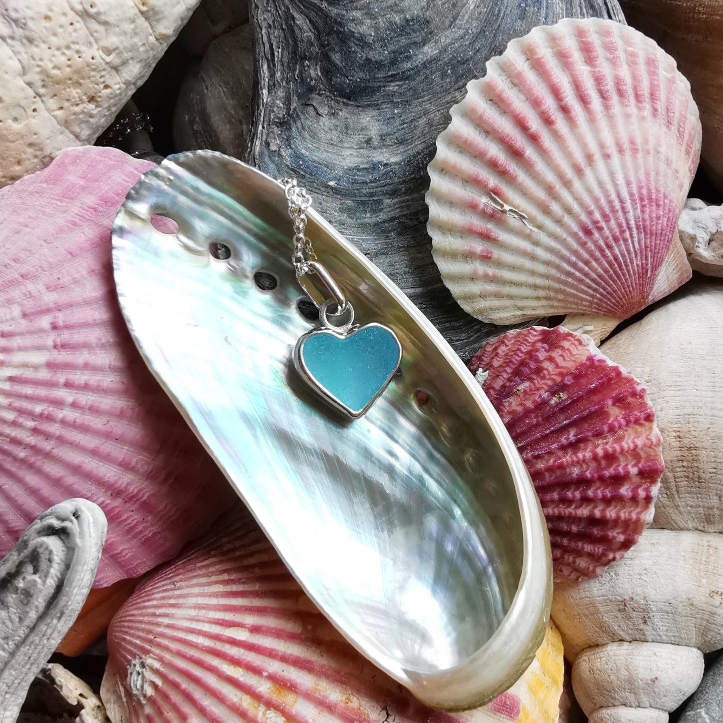 Light aquamarine blue sea glass heart & sterling silver pendant.
