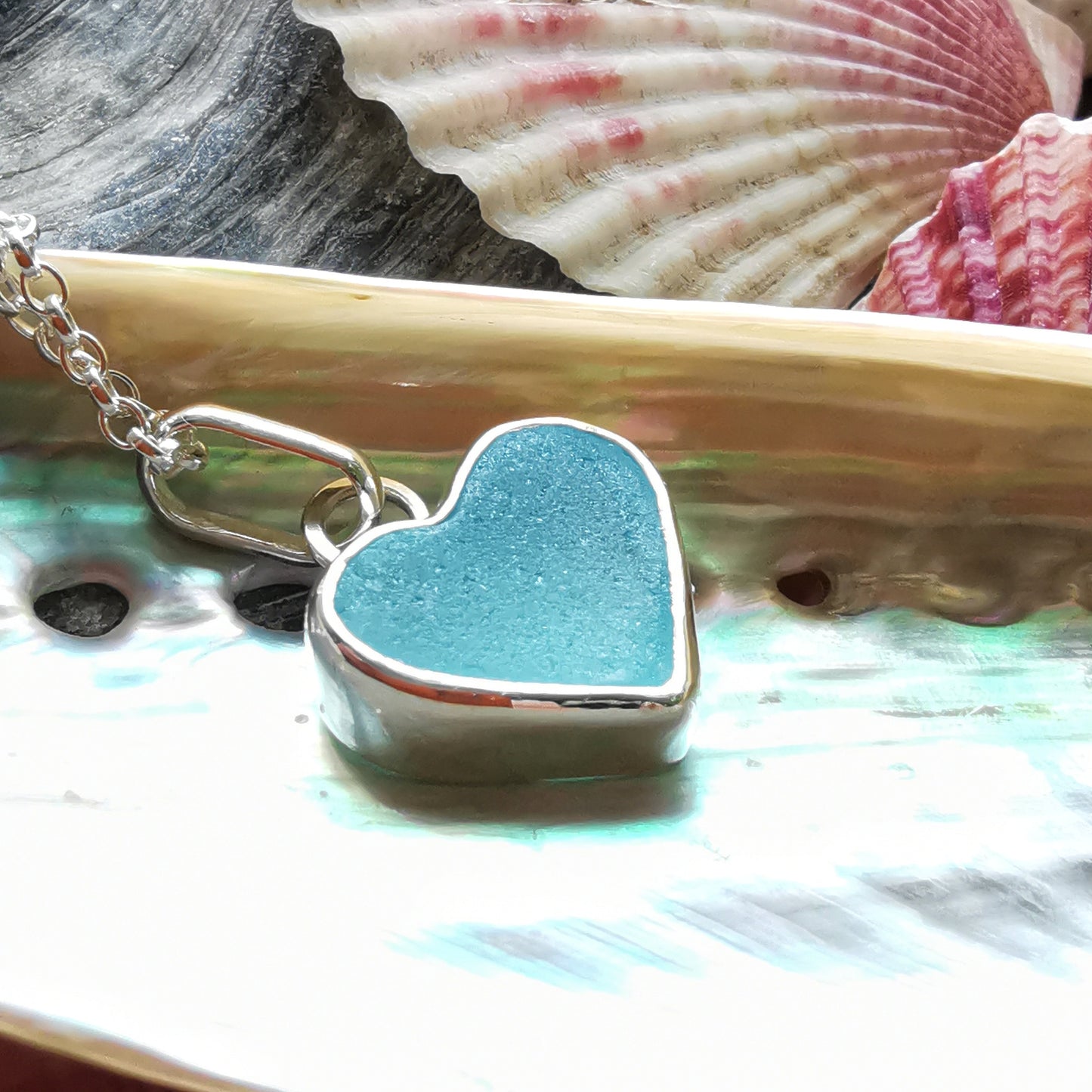 Light aquamarine blue sea glass heart & sterling silver pendant.