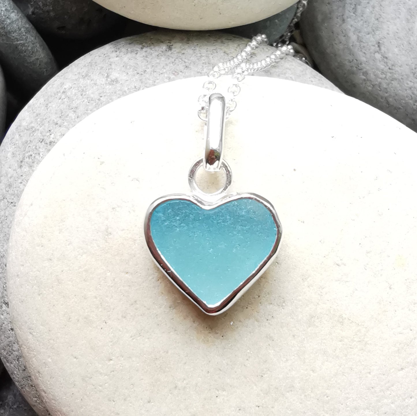 Light aquamarine blue sea glass heart & sterling silver pendant.