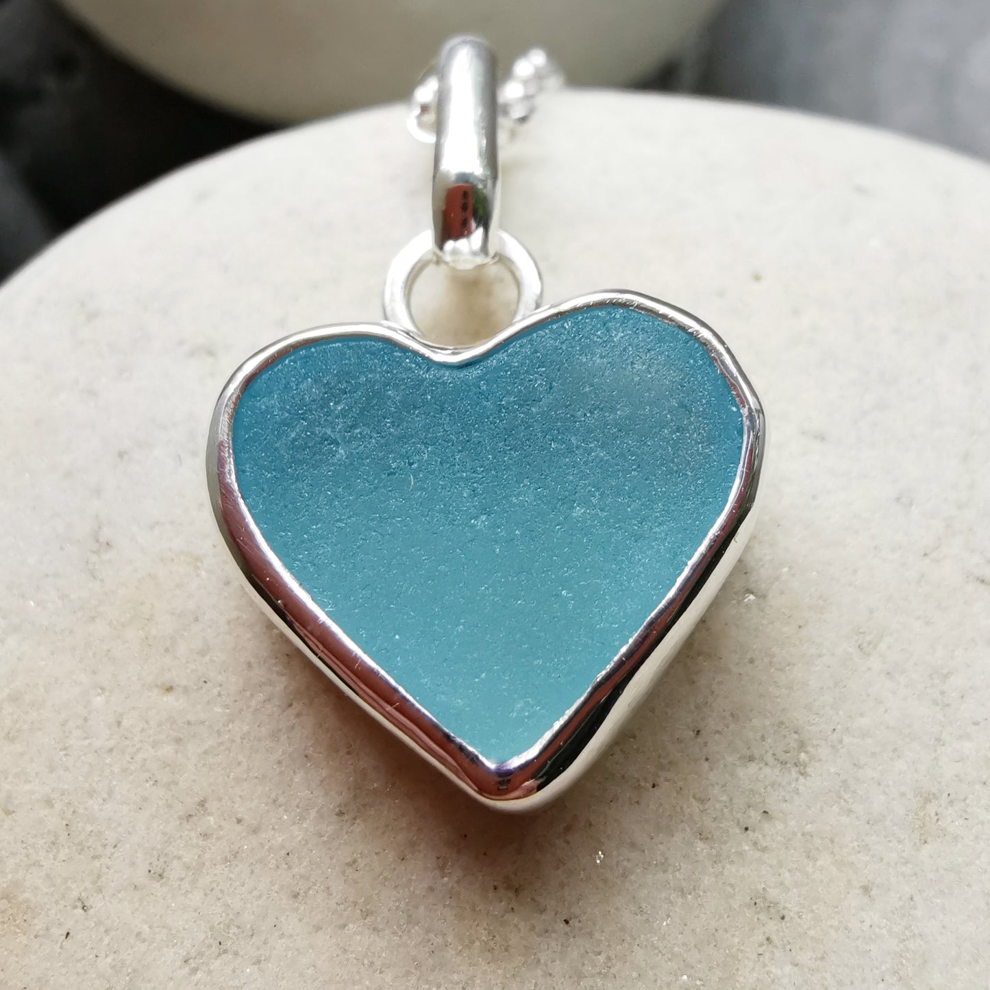 Light aquamarine blue sea glass heart & sterling silver pendant.