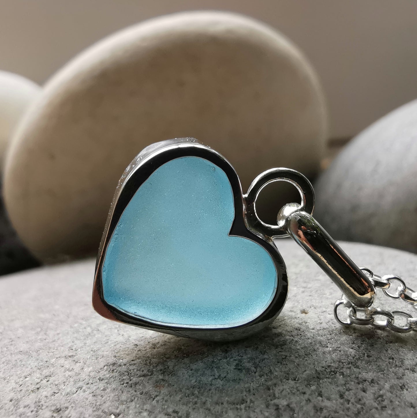 Light aquamarine blue sea glass heart & sterling silver pendant.