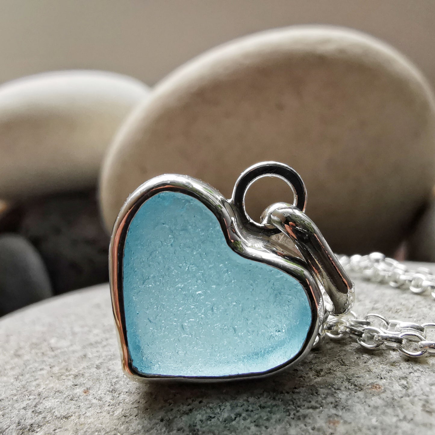 Light aquamarine blue sea glass heart & sterling silver pendant.