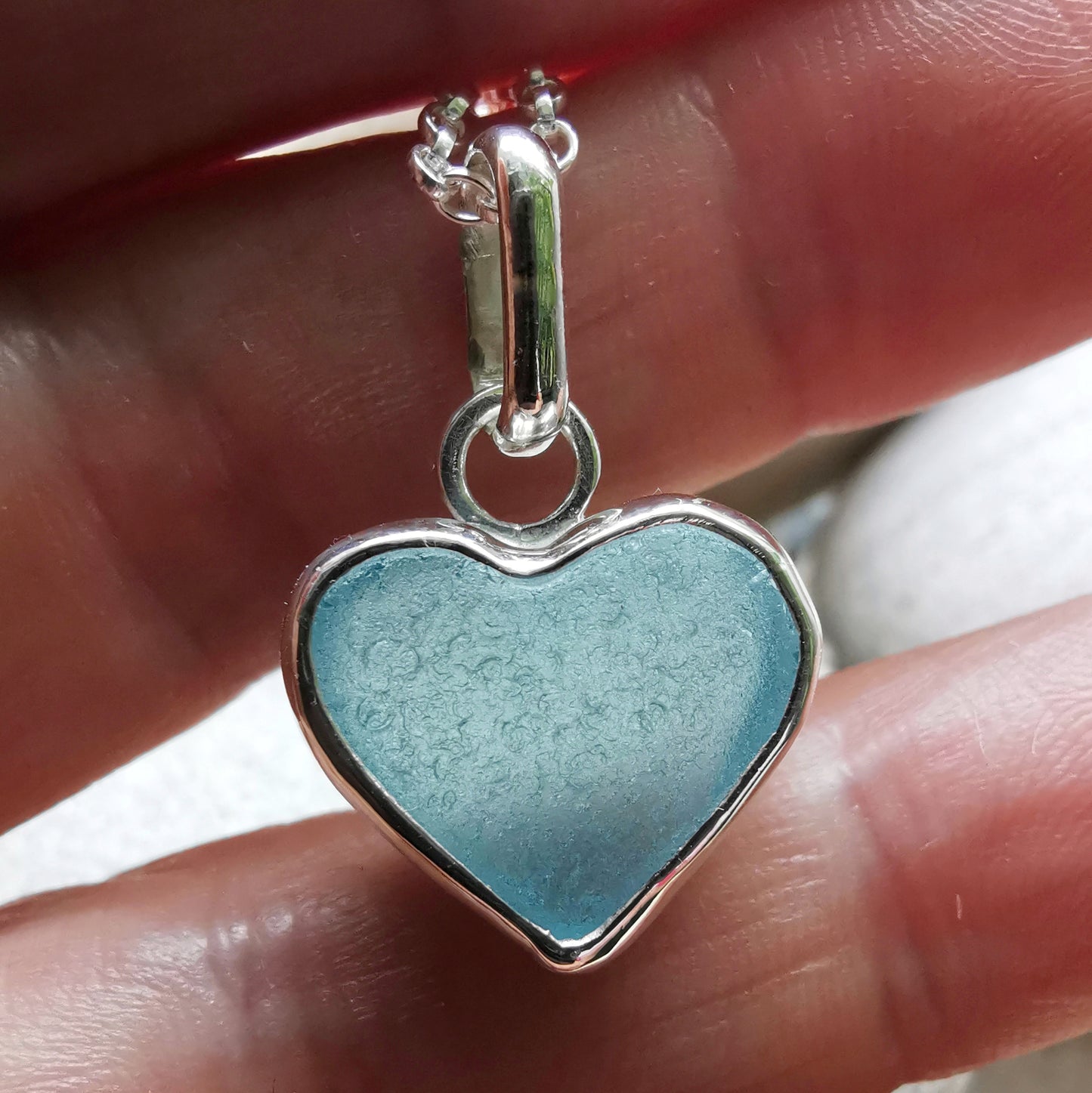 Light aquamarine blue sea glass heart & sterling silver pendant.