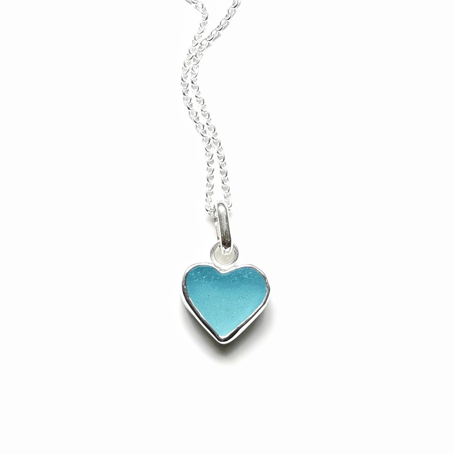 Light aquamarine blue sea glass heart & sterling silver pendant.