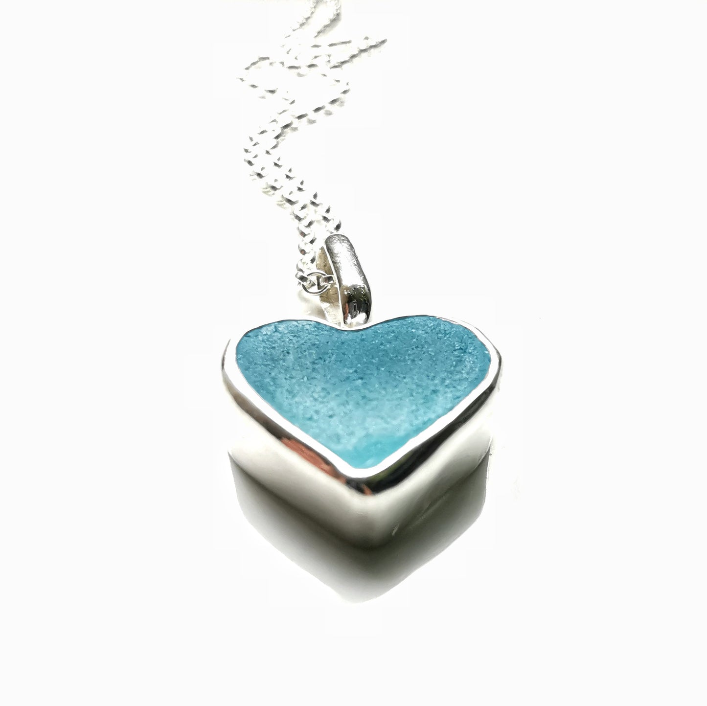 Light aquamarine blue sea glass heart & sterling silver pendant.