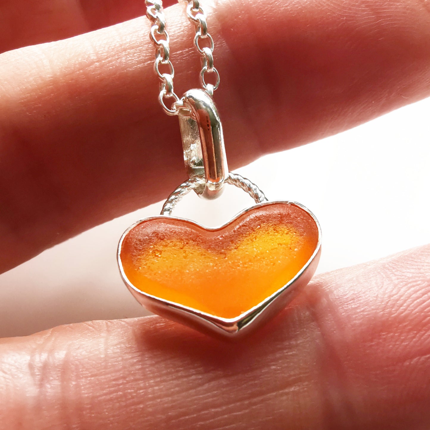 Scottish orange UV sea glass heart & sterling silver pendant.