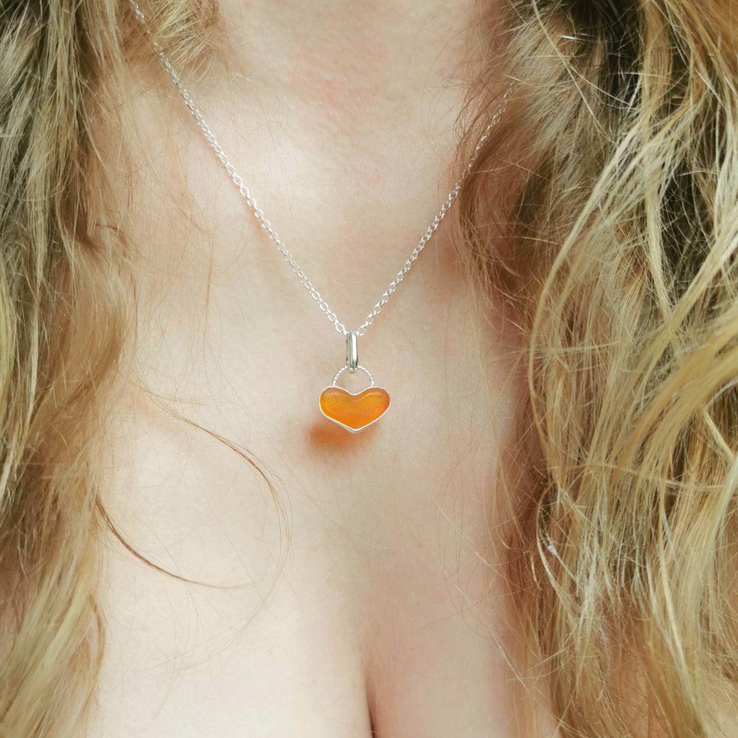 Scottish orange UV sea glass heart & sterling silver pendant.
