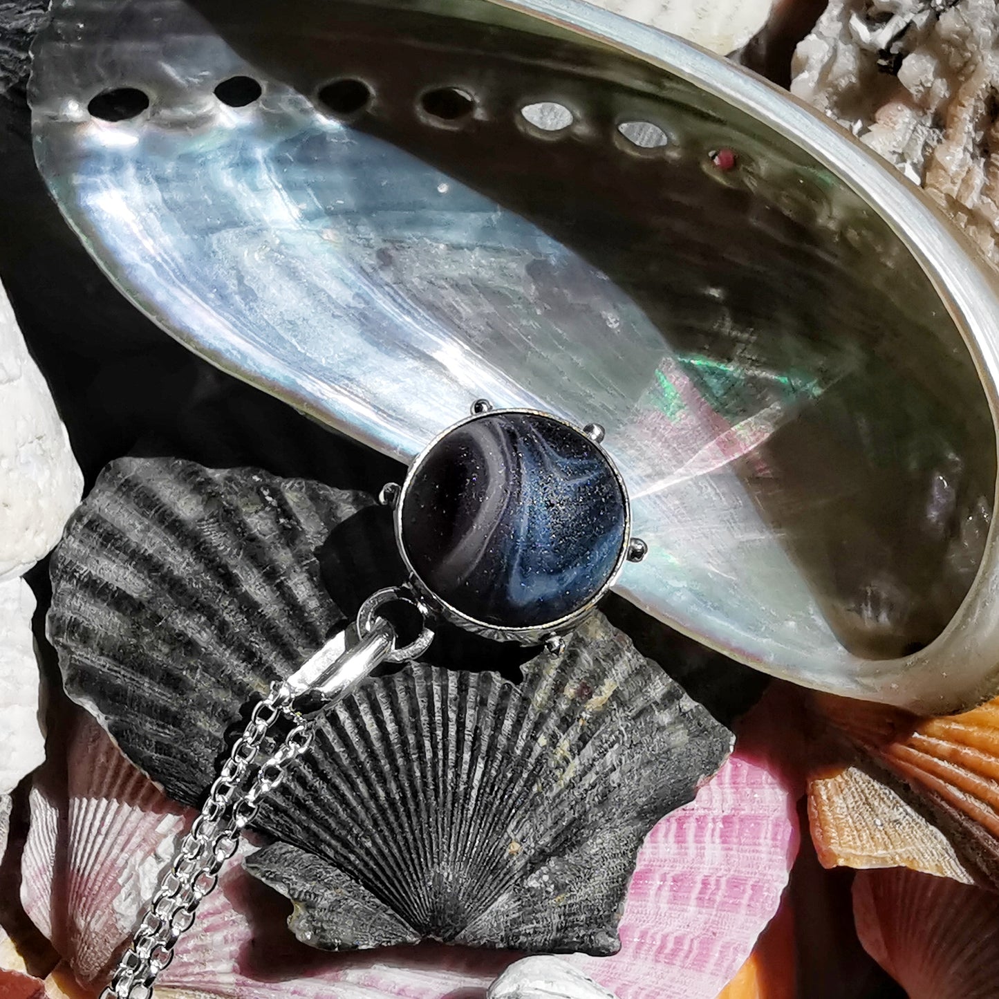 Genuine Scottish purple sea glass marble & sterling silver pendant.