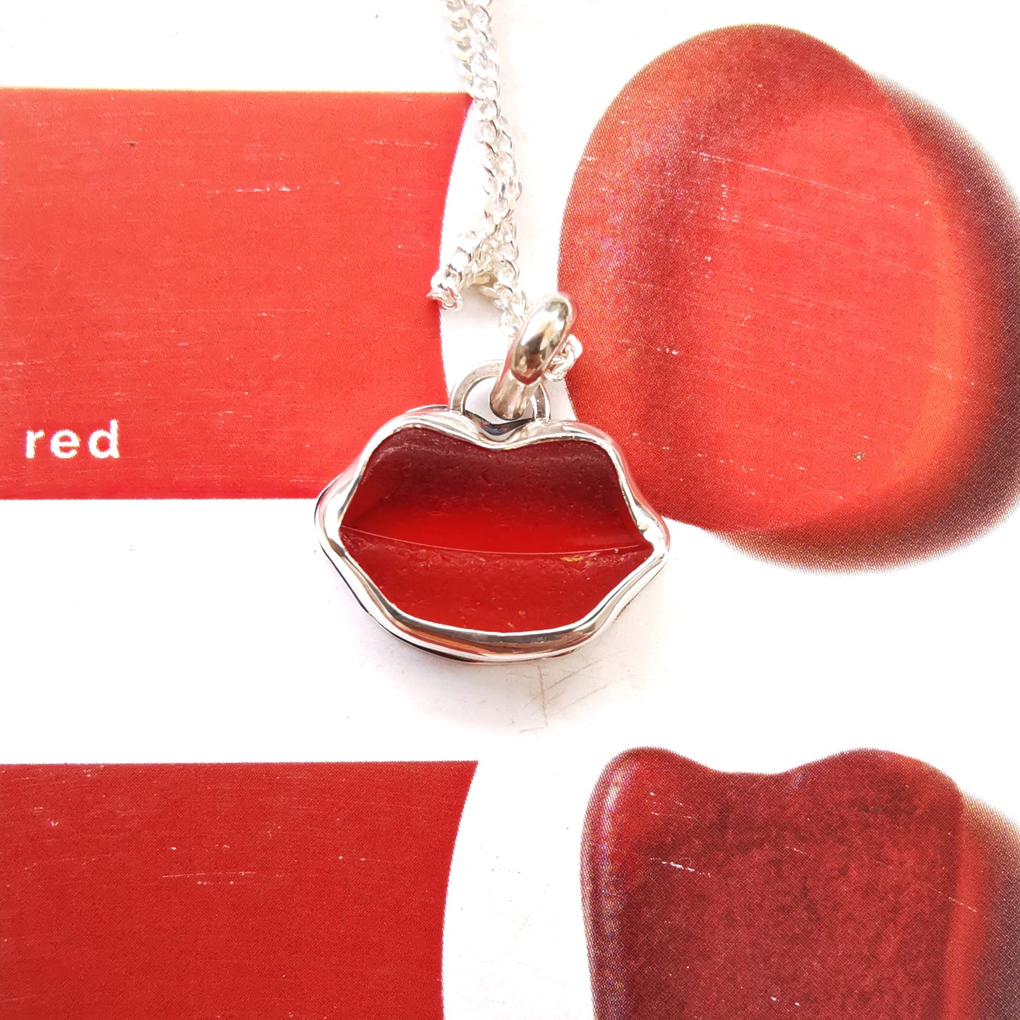 Scottish red  lips/kiss sea glass & sterling silver pendant.