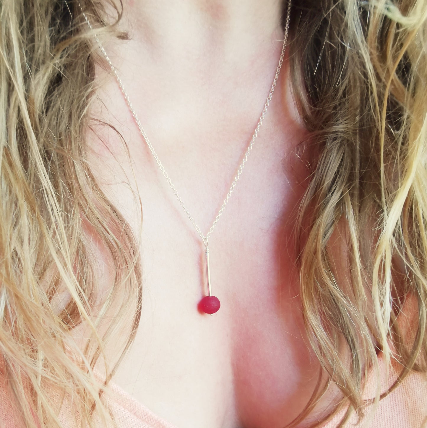 Scottish red sea glass bead & sterling silver pendant.