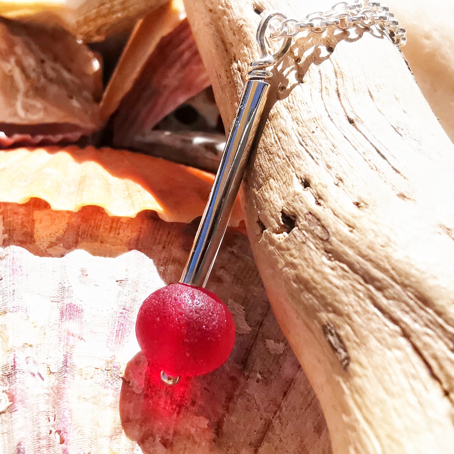 Scottish red sea glass bead & sterling silver pendant.