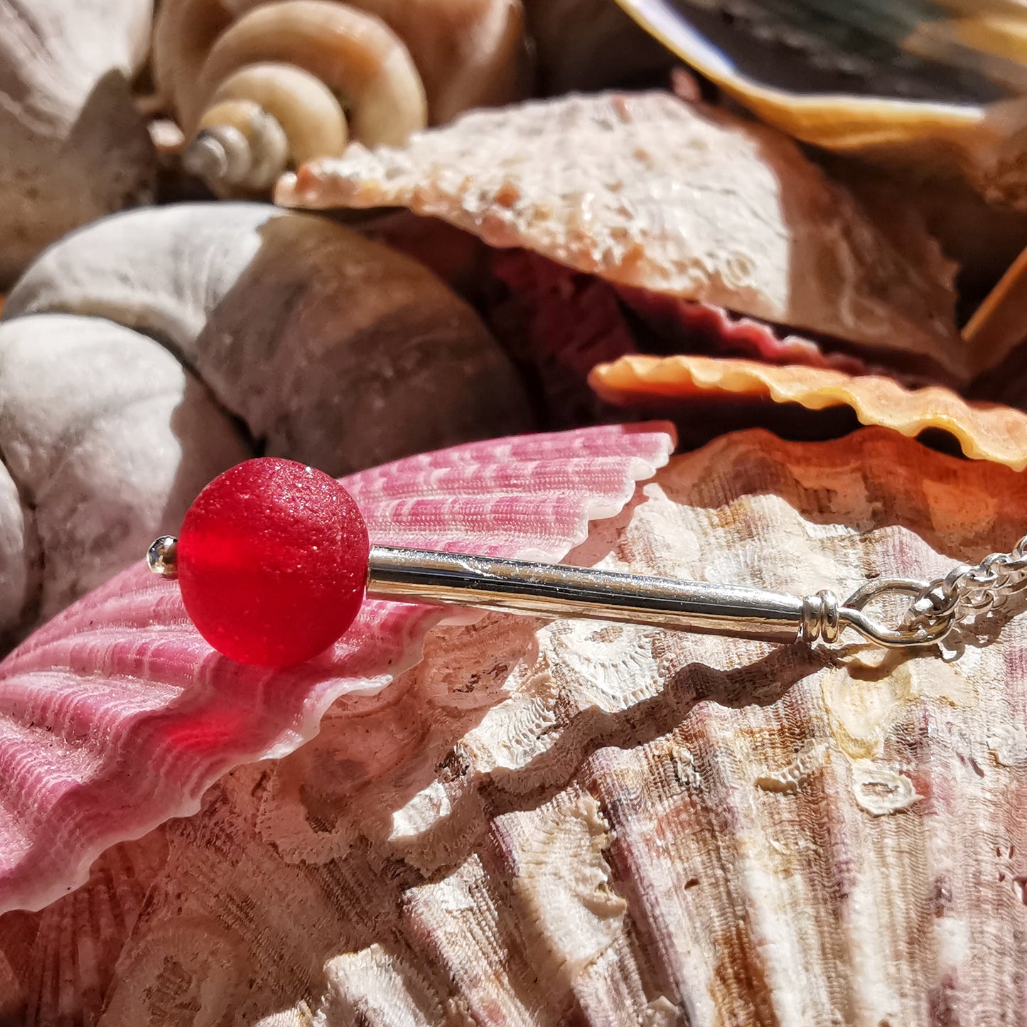 Scottish red sea glass bead & sterling silver pendant.