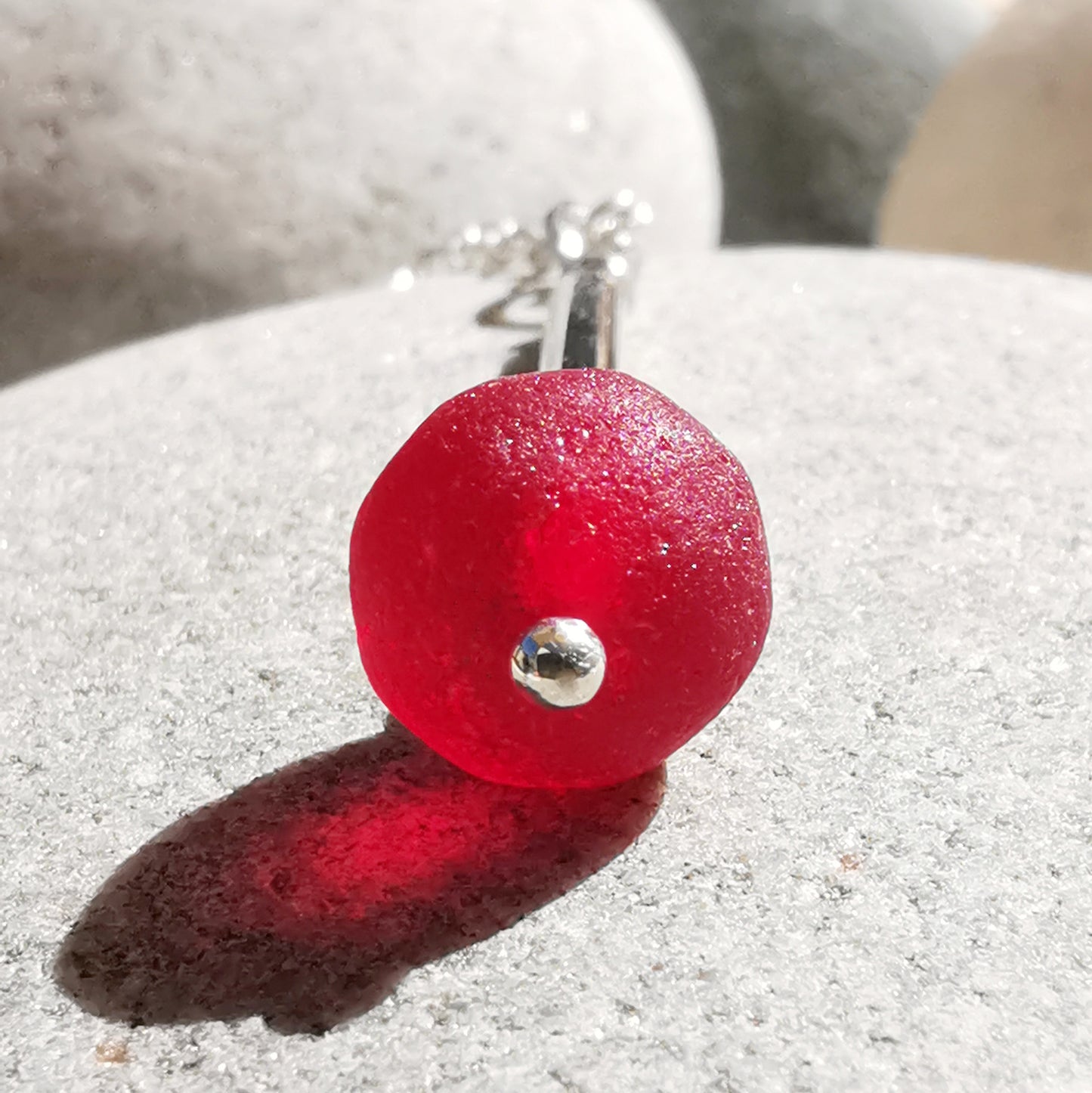 Scottish red sea glass bead & sterling silver pendant.