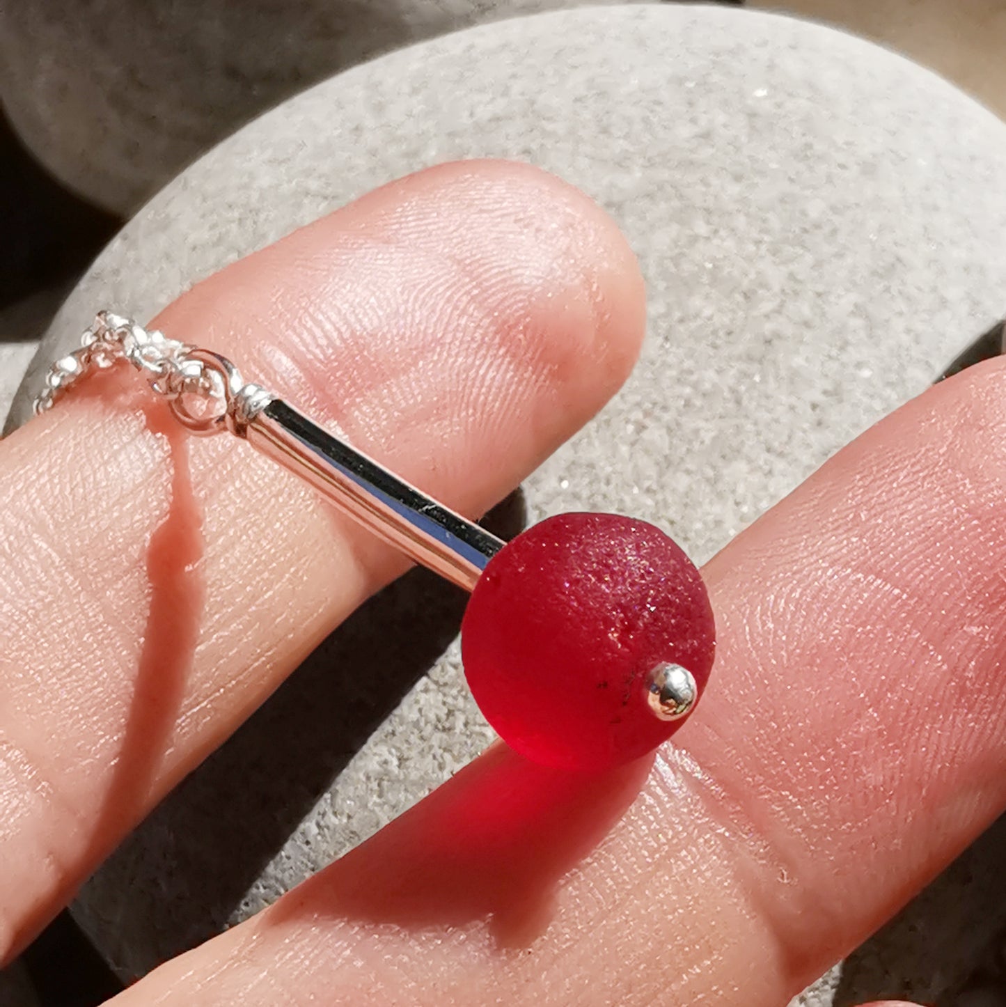 Scottish red sea glass bead & sterling silver pendant.