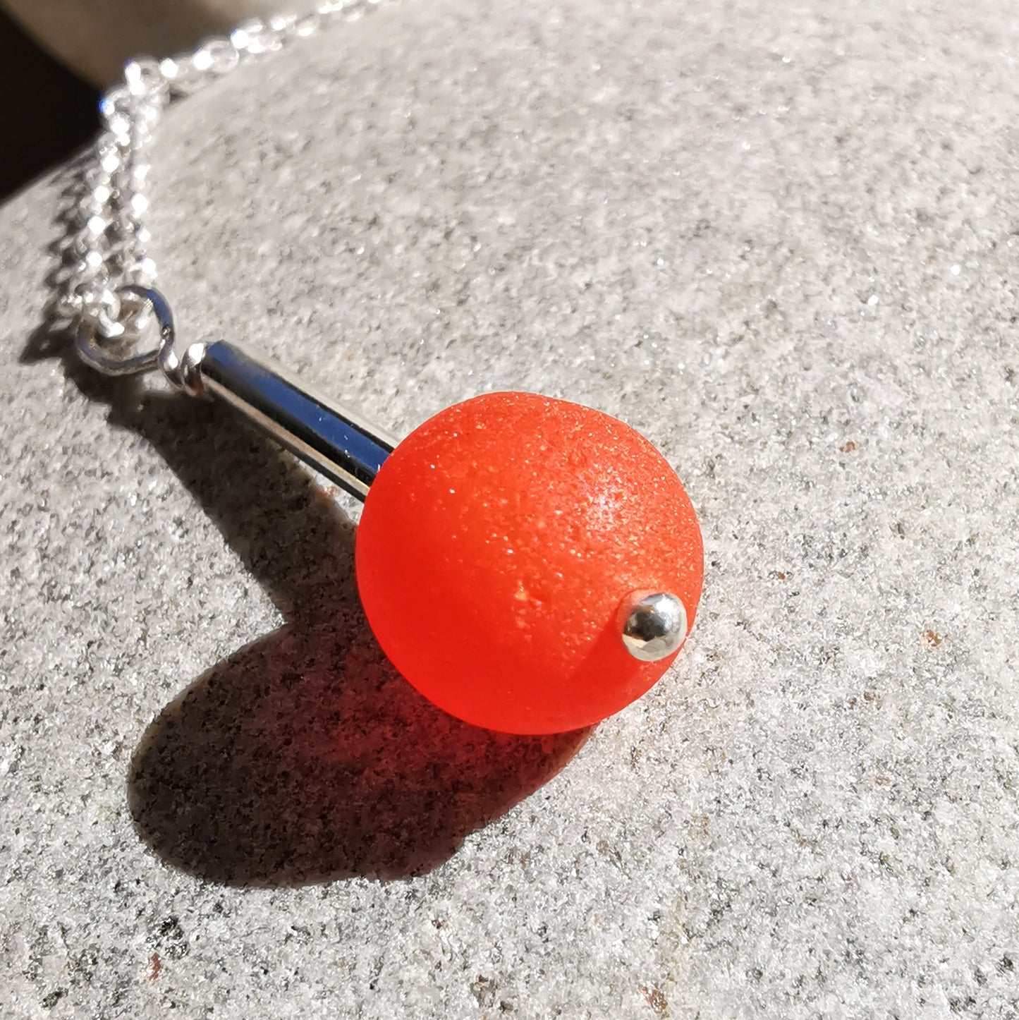 Scottish orange sea glass bead & sterling silver pendant.