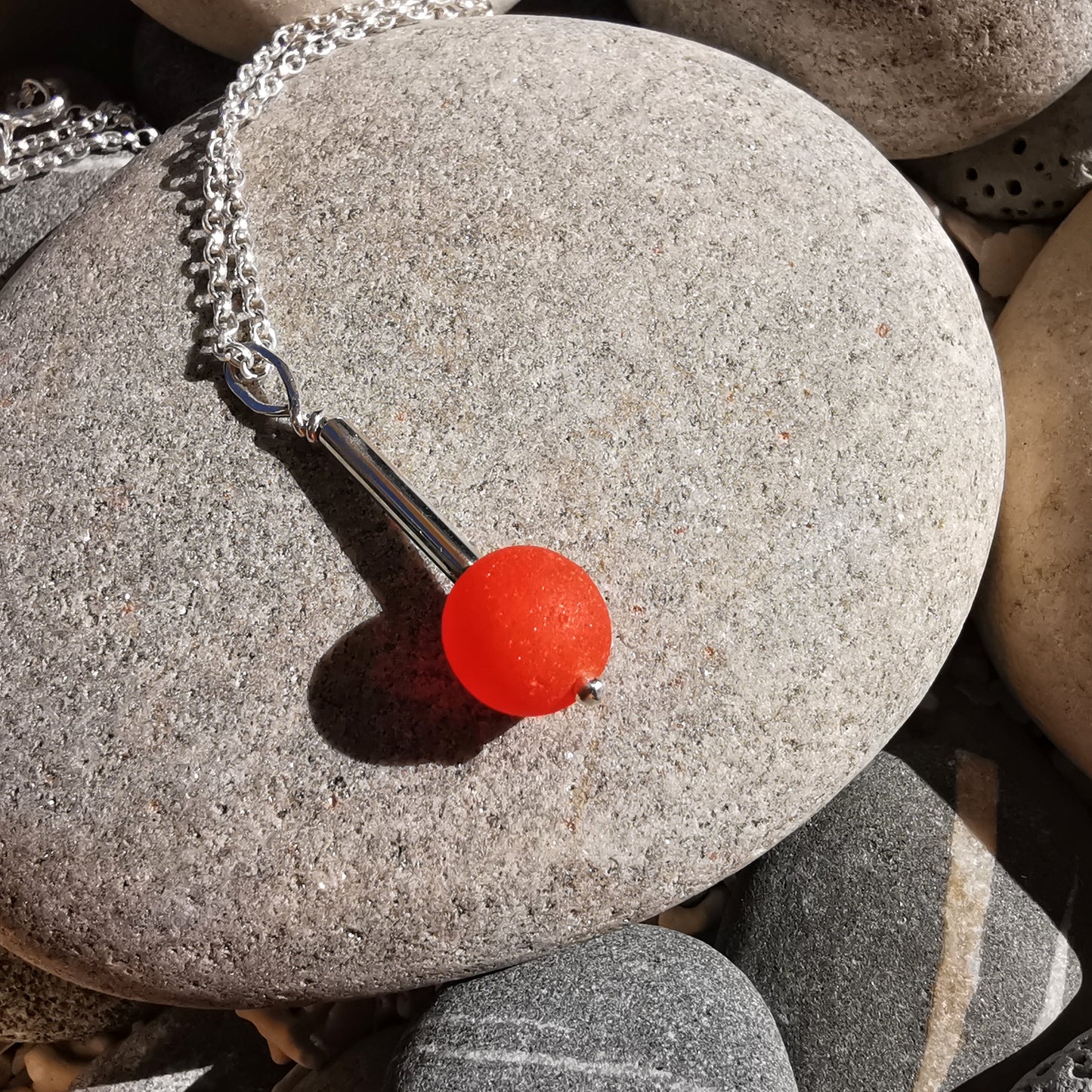 Scottish orange sea glass bead & sterling silver pendant.