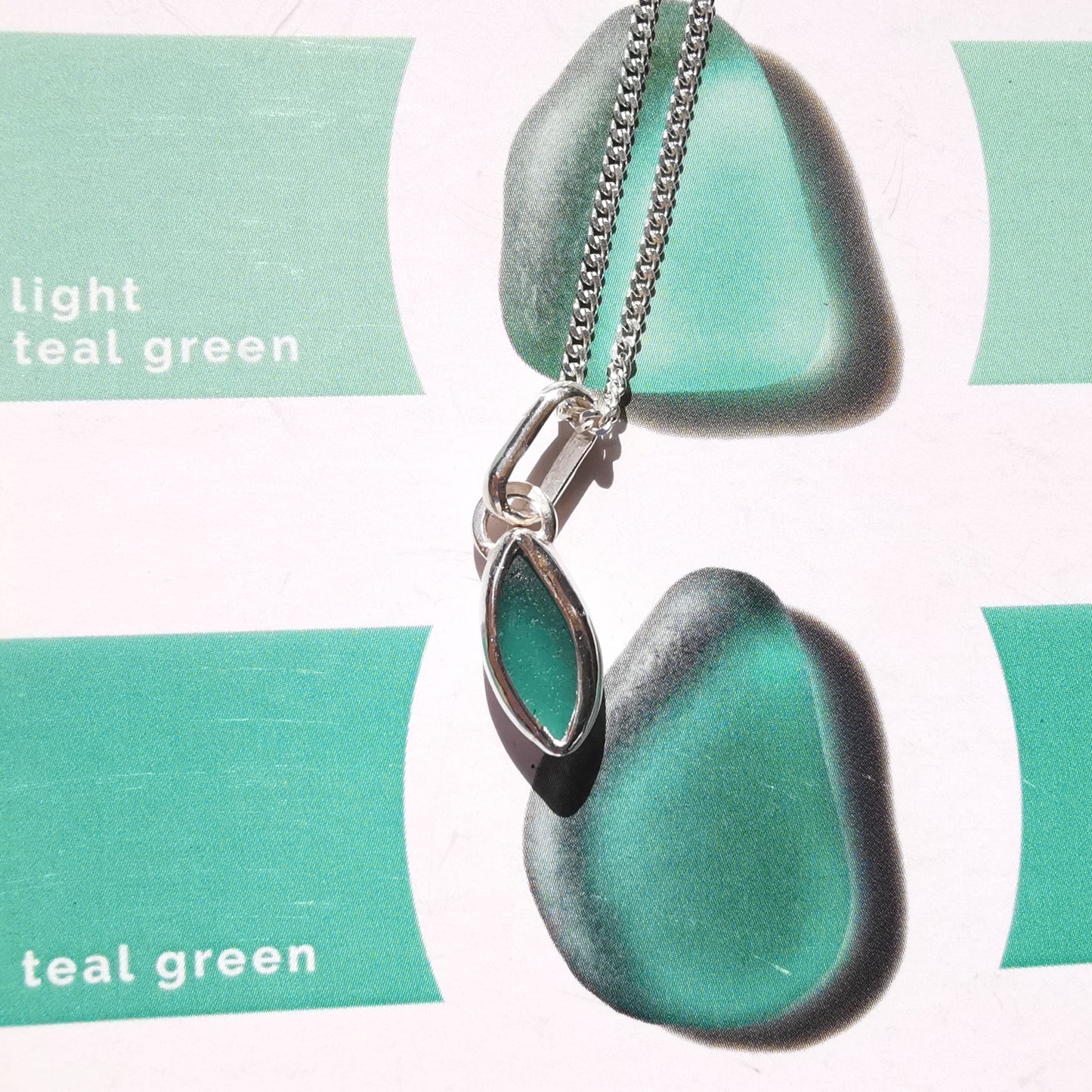 Tiny Scottish teal sea glass & sterling silver pendant.