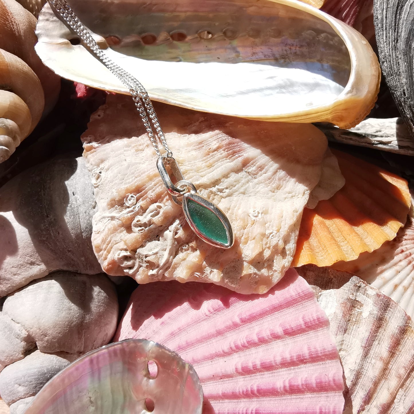 Tiny Scottish teal sea glass & sterling silver pendant.