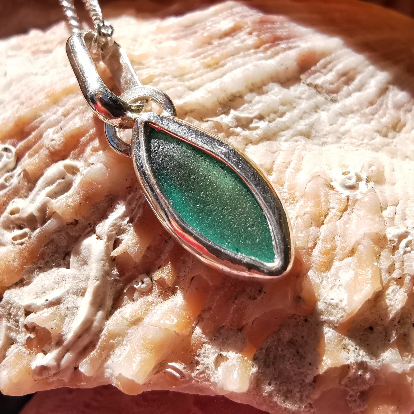 Tiny Scottish teal sea glass & sterling silver pendant.