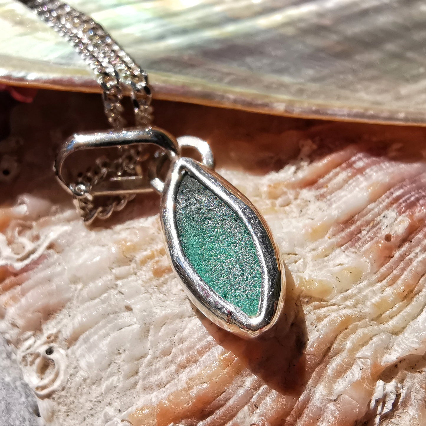Tiny Scottish teal sea glass & sterling silver pendant.