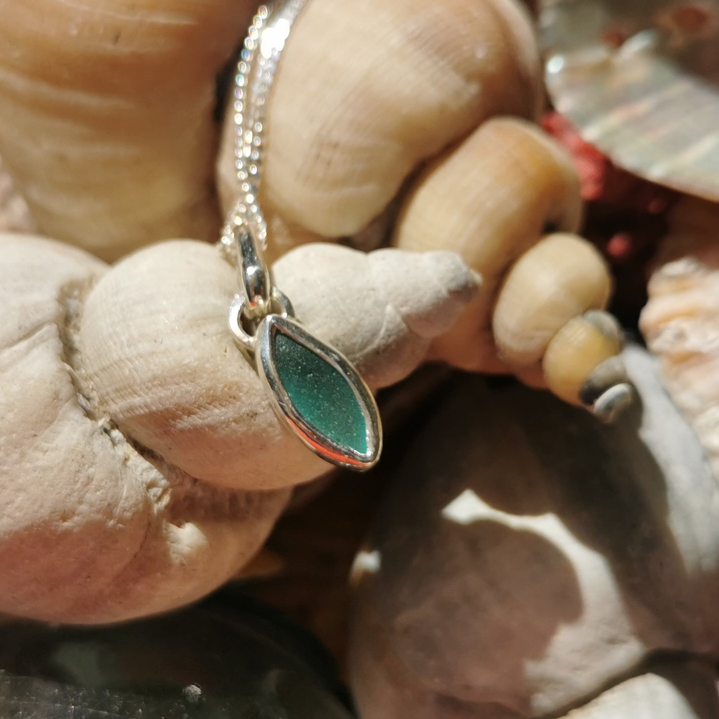 Tiny Scottish teal sea glass & sterling silver pendant.