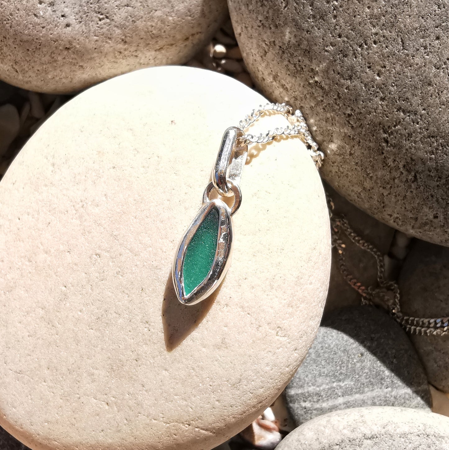 Tiny Scottish teal sea glass & sterling silver pendant.