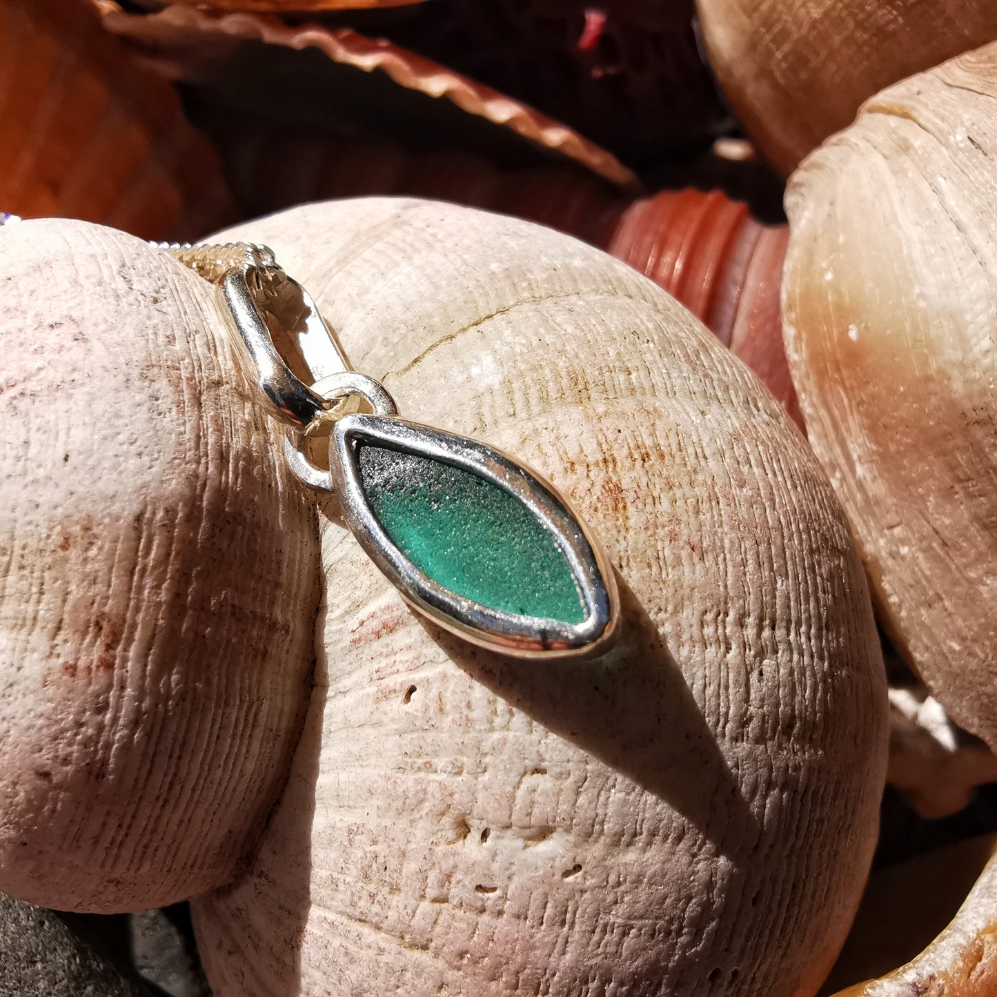 Tiny Scottish teal sea glass & sterling silver pendant.