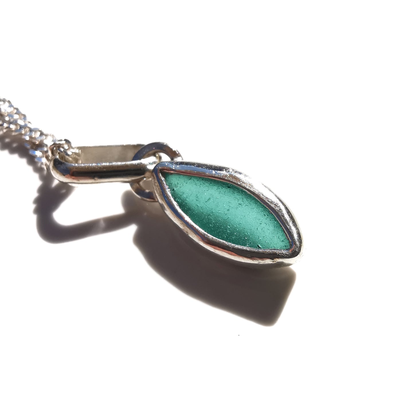 Tiny Scottish teal sea glass & sterling silver pendant.