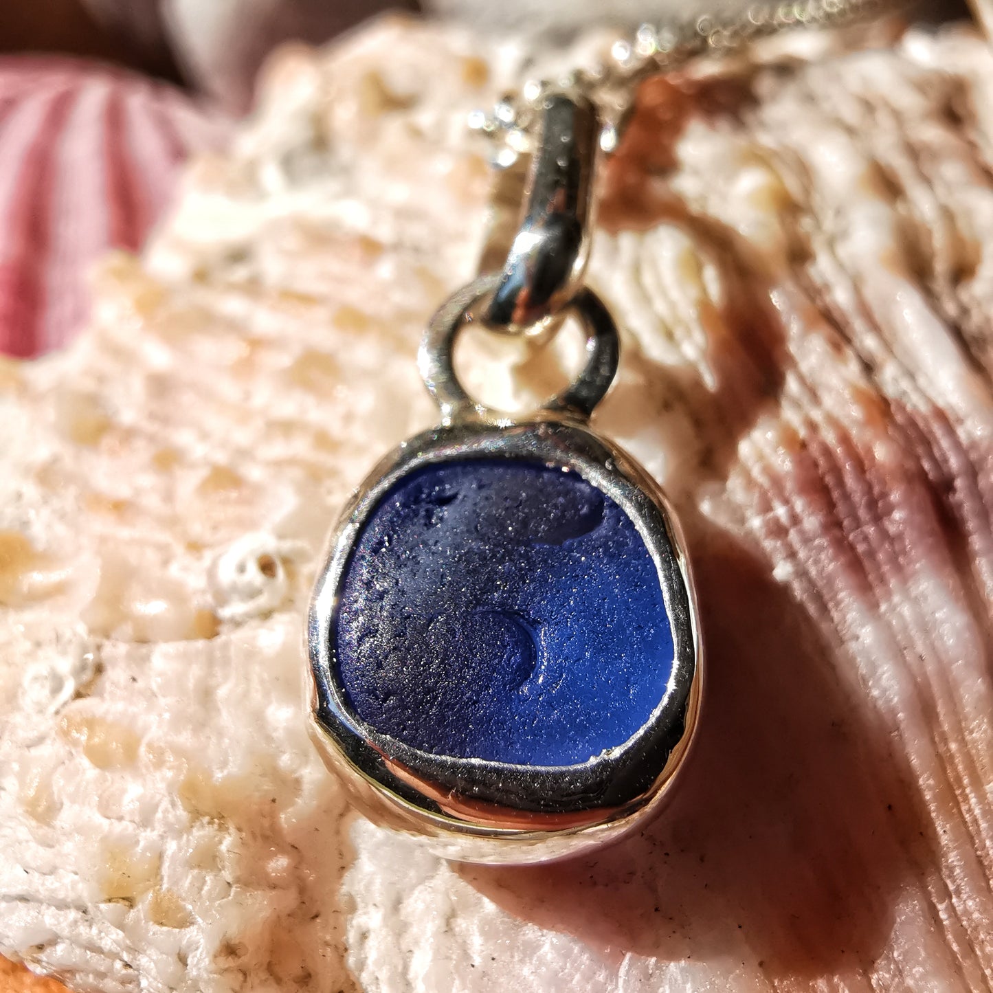 Tiny Scottish cornflower blue sea glass & sterling silver pendant.