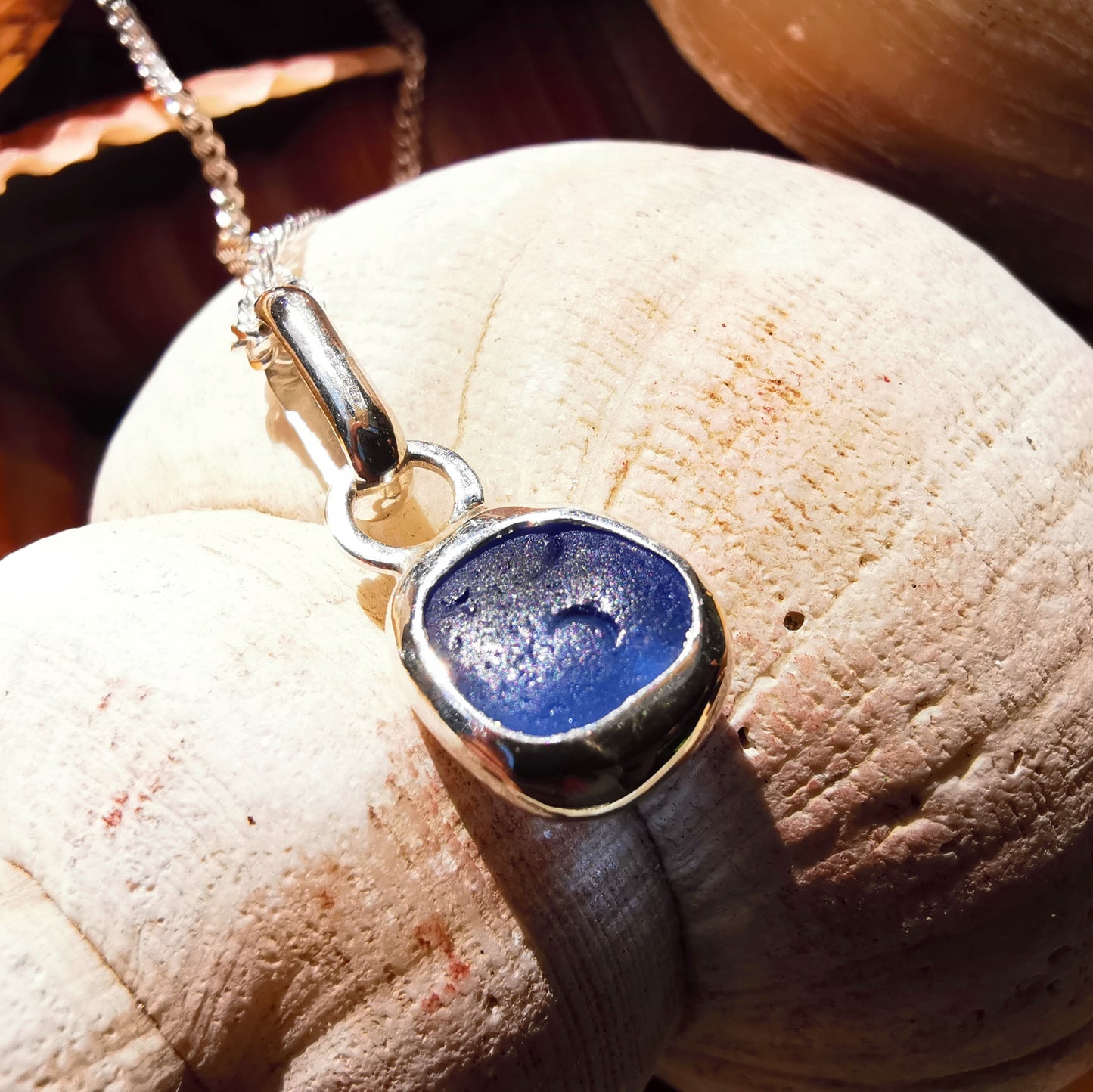 Tiny Scottish cornflower blue sea glass & sterling silver pendant.