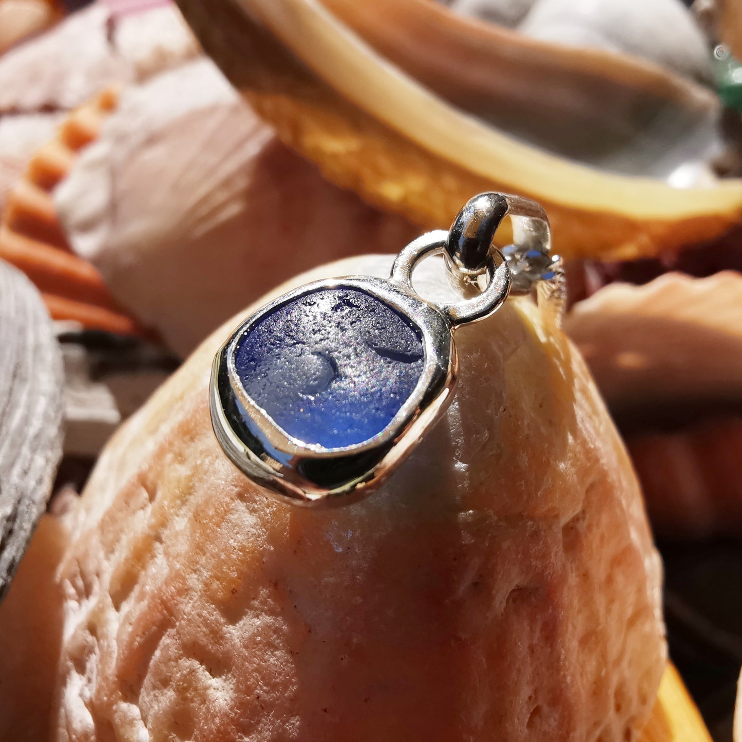 Tiny Scottish cornflower blue sea glass & sterling silver pendant.