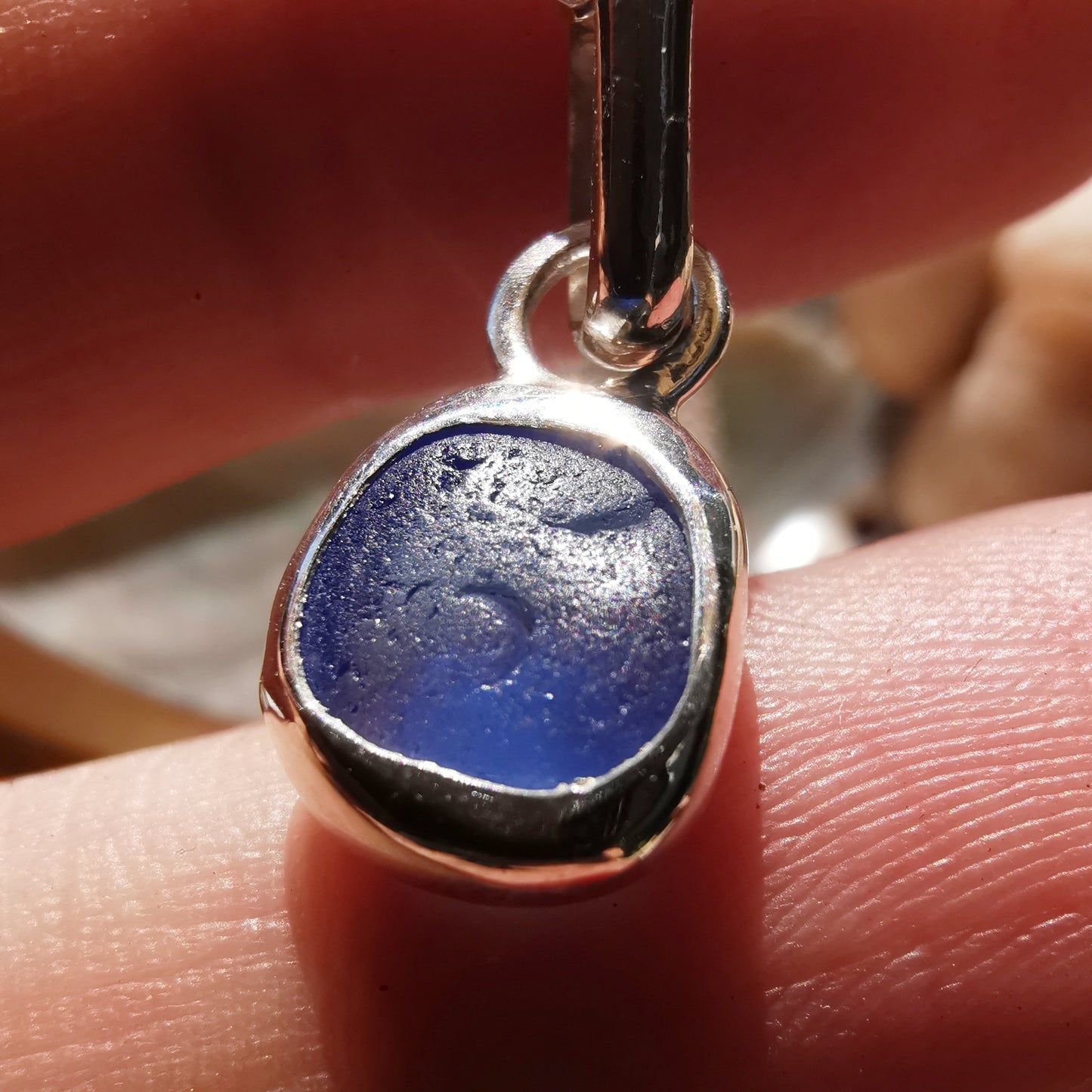 Tiny Scottish cornflower blue sea glass & sterling silver pendant.