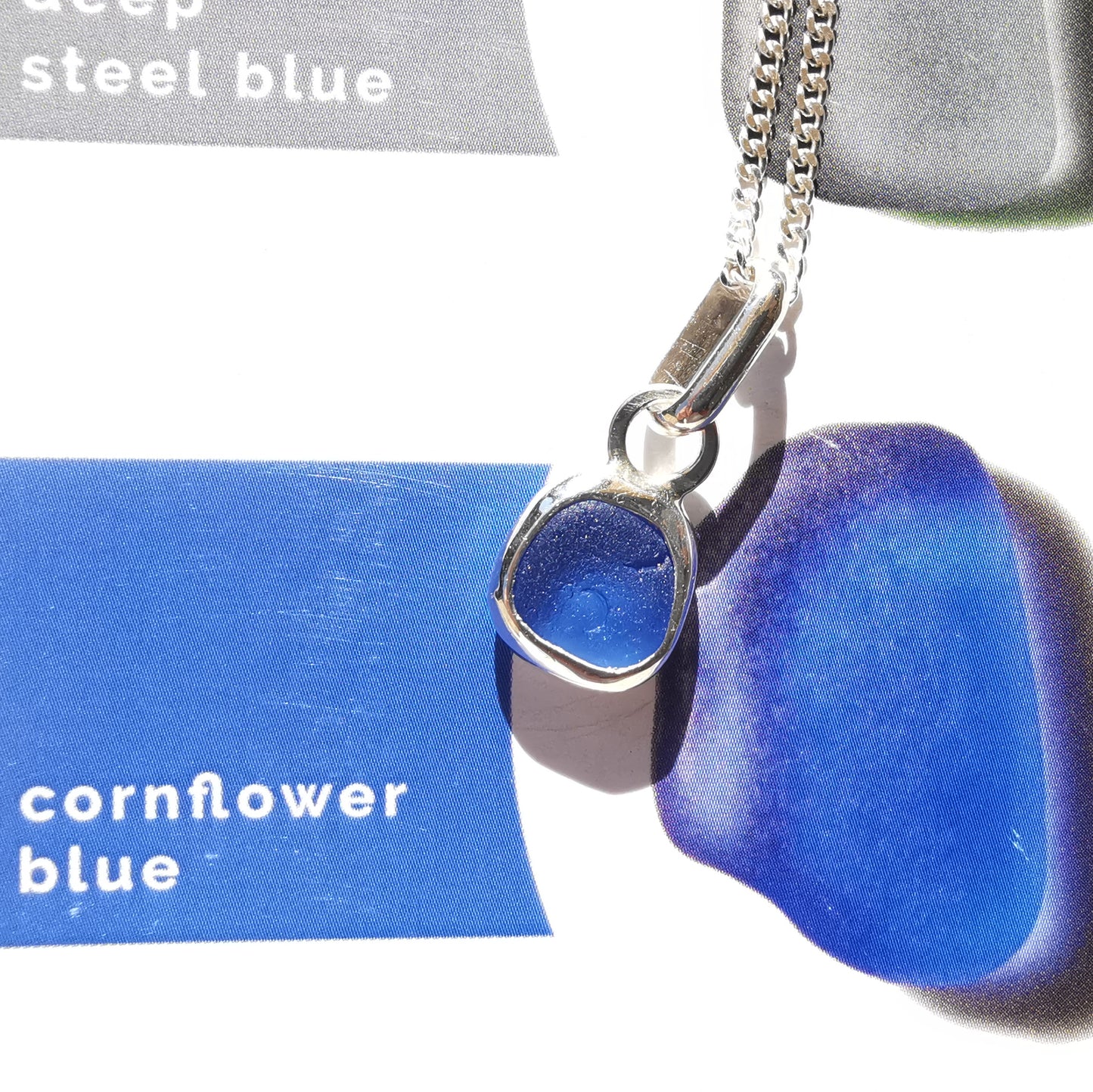 Tiny Scottish cornflower blue sea glass & sterling silver pendant.