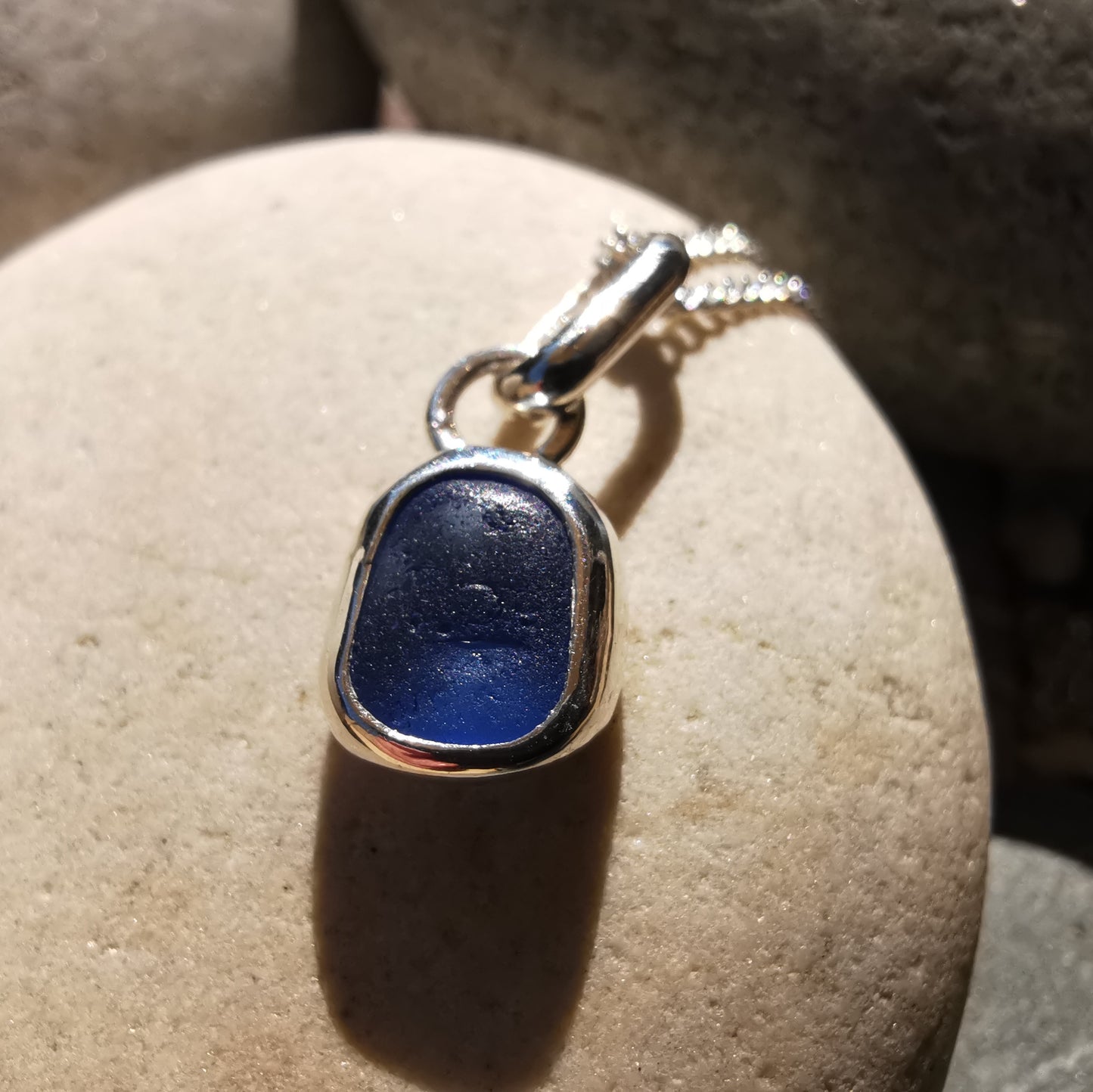 Tiny Scottish cornflower blue sea glass & sterling silver pendant.