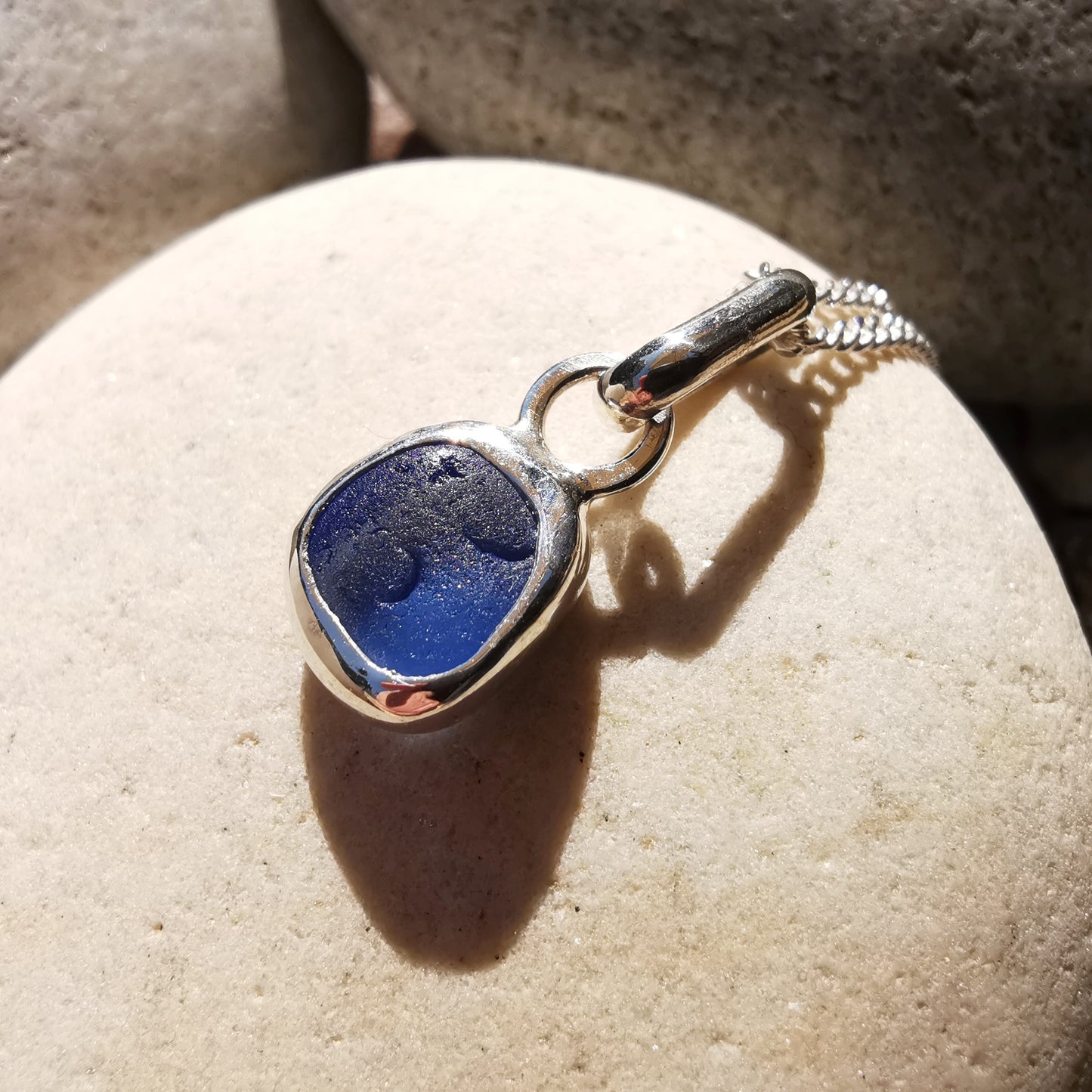 Tiny Scottish cornflower blue sea glass & sterling silver pendant.