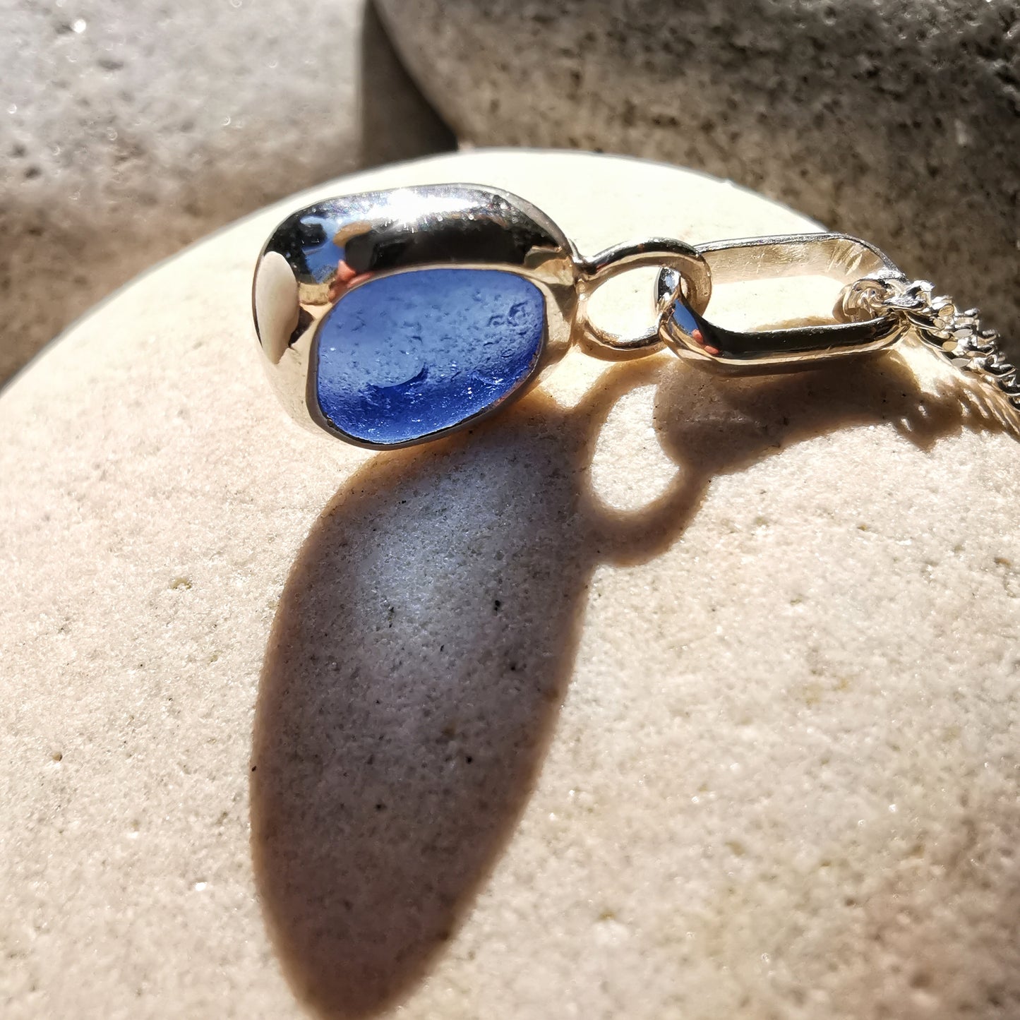 Tiny Scottish cornflower blue sea glass & sterling silver pendant.