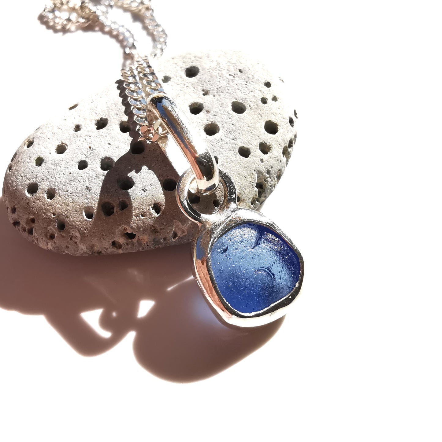 Tiny Scottish cornflower blue sea glass & sterling silver pendant.