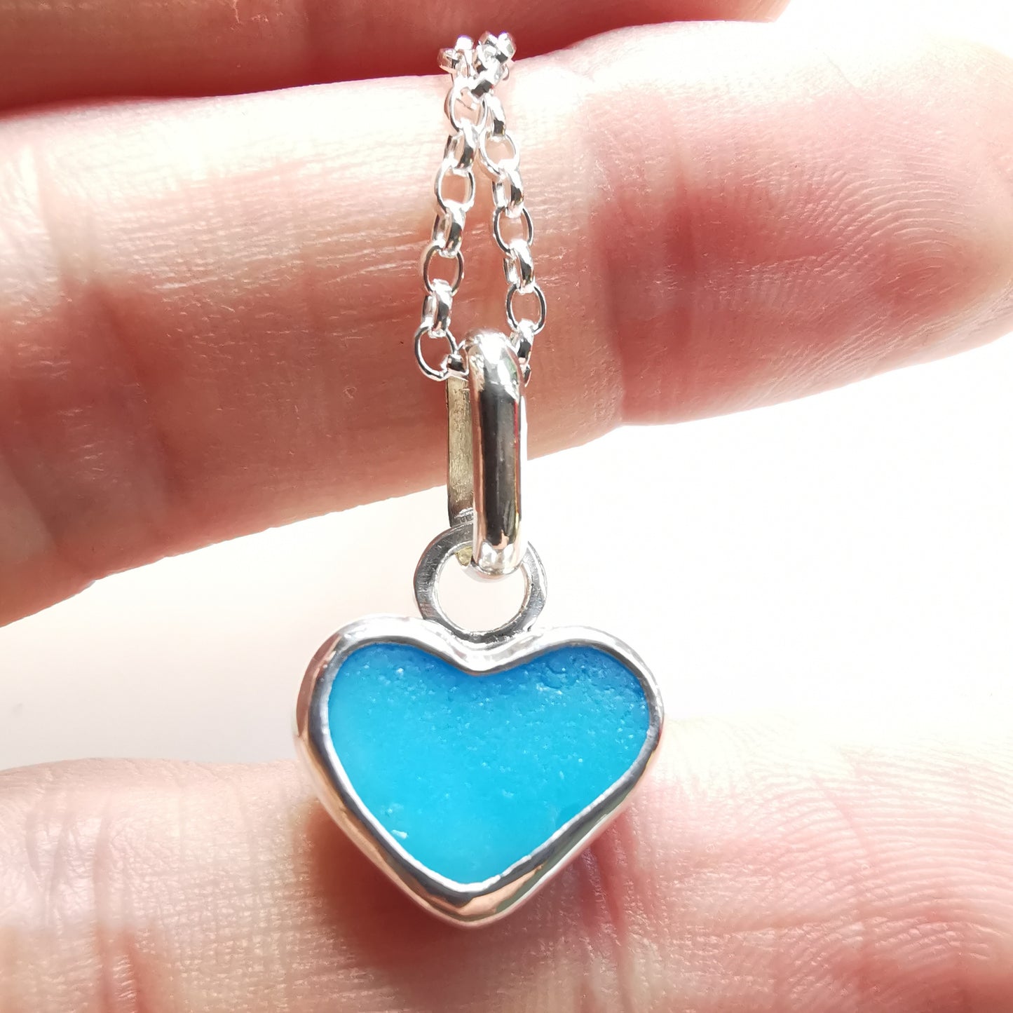 Aquamarine blue sea glass heart & sterling silver pendant.